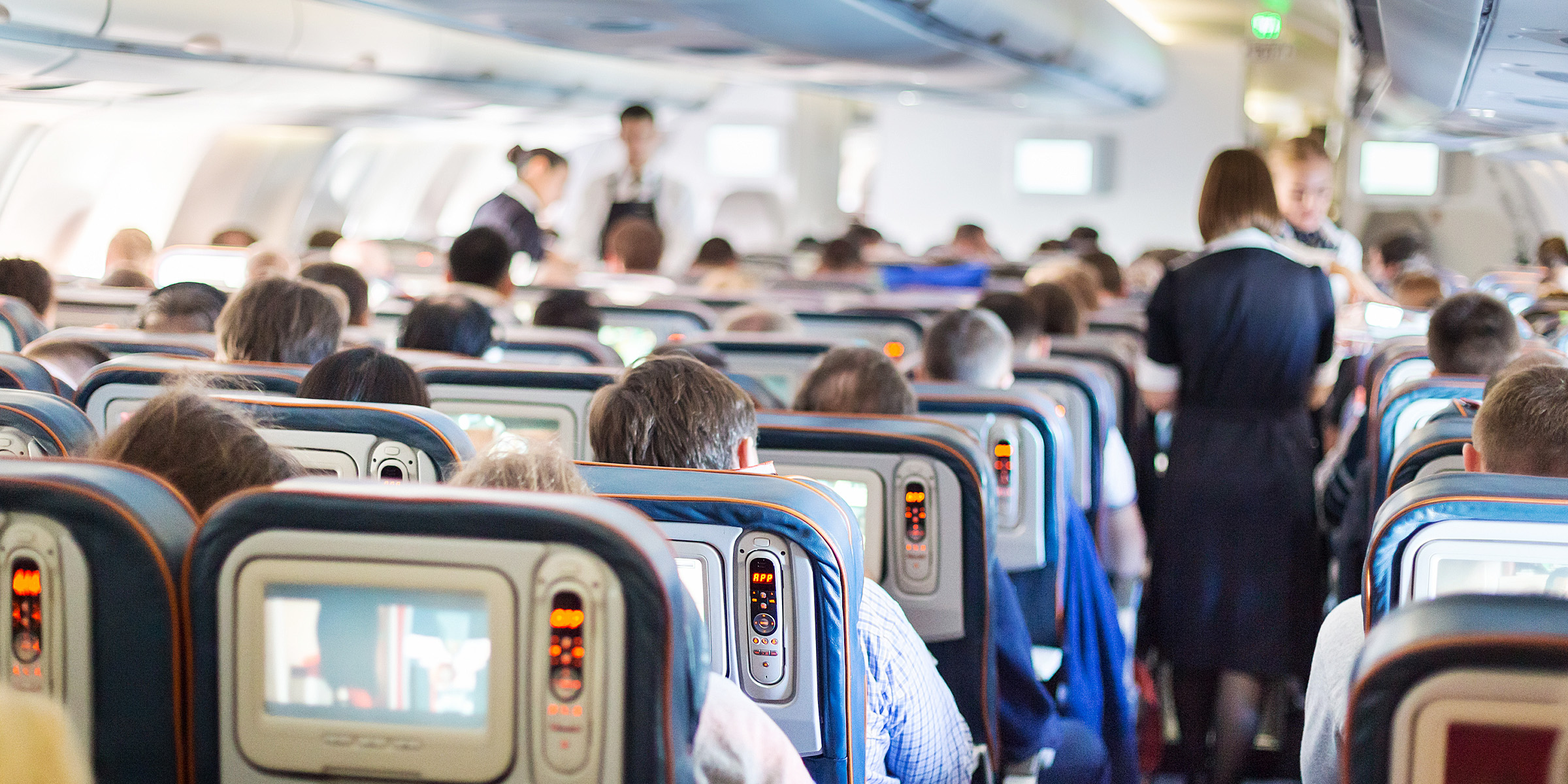 Passengers on a plane | Source: Shutterstock