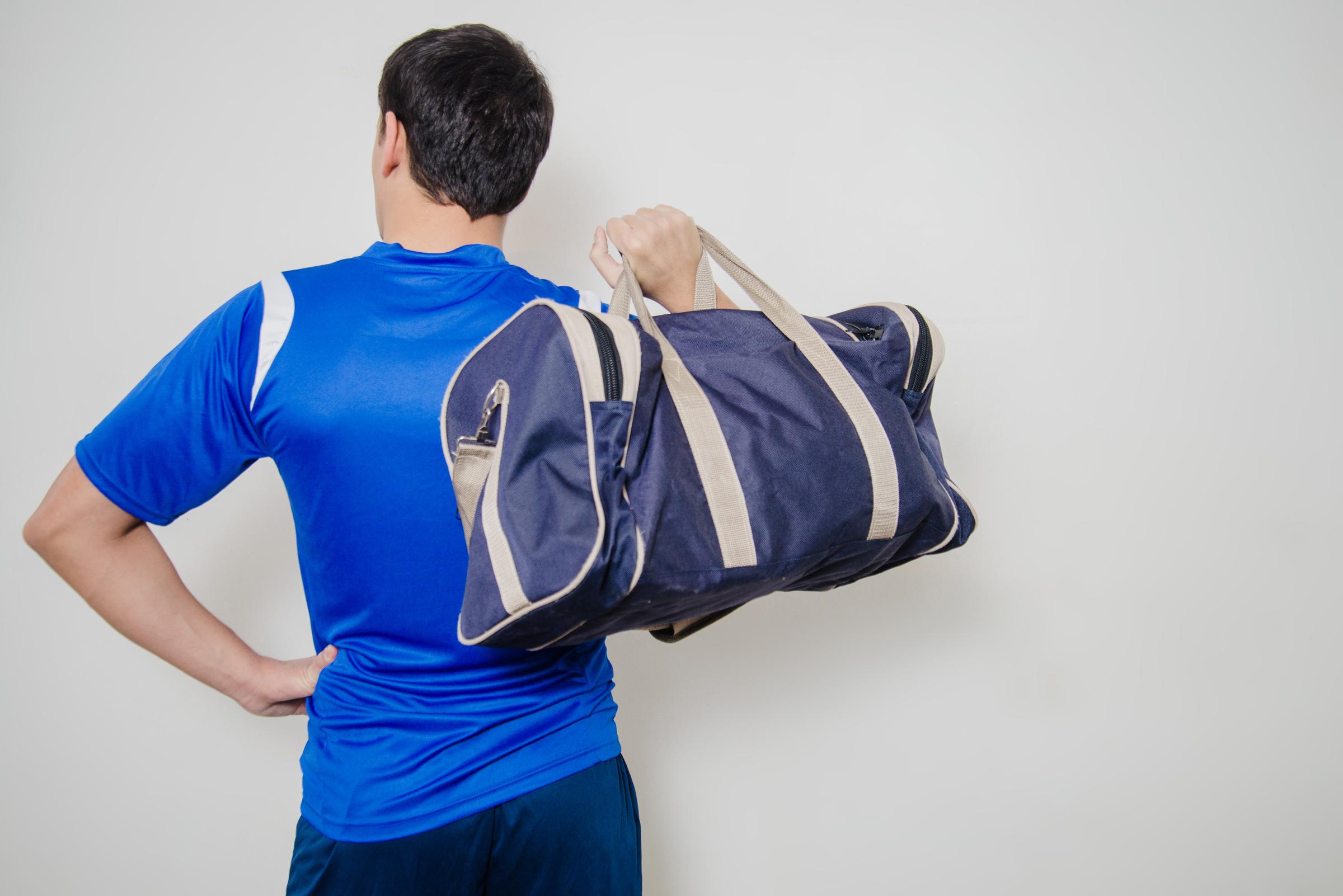 A man holding a bag | Source: Freepik