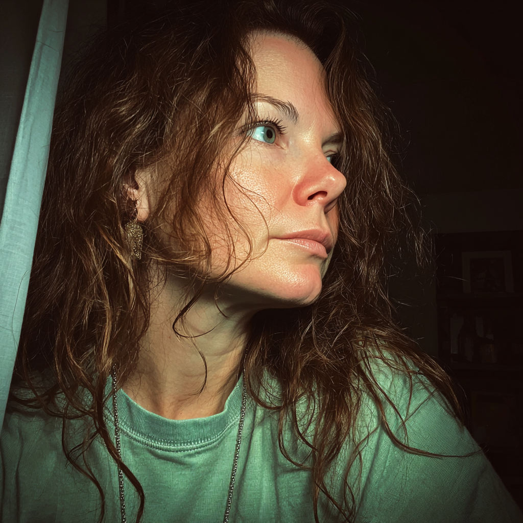 A pensive woman standing in a living room | Source: Midjourney