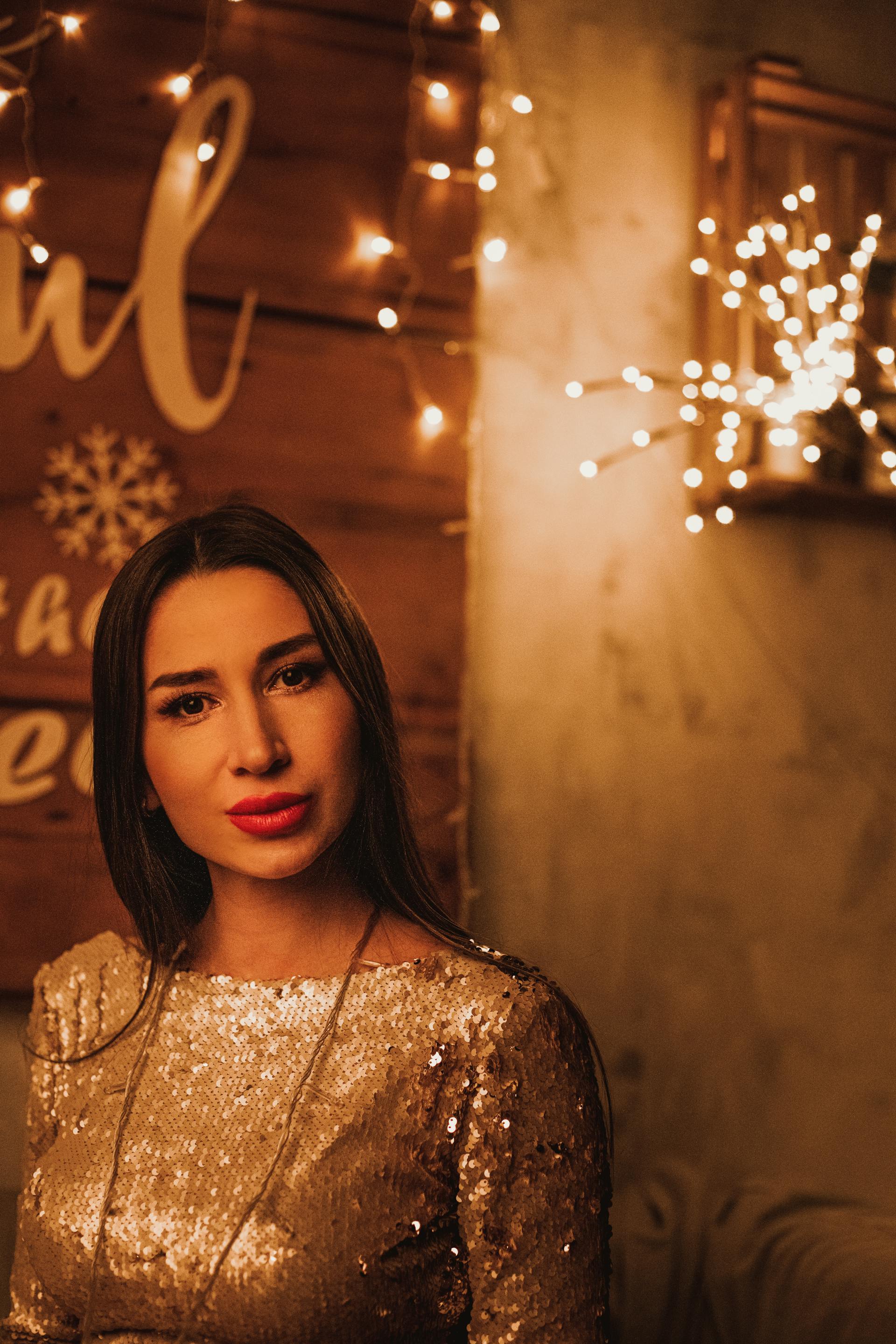 An elegant woman in a shimmering top | Source: Pexels
