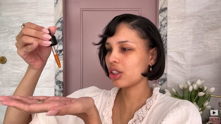 Nara Smith doing her skincare routine from a video dated December 12, 2024. | Source: YouTube/Vogue