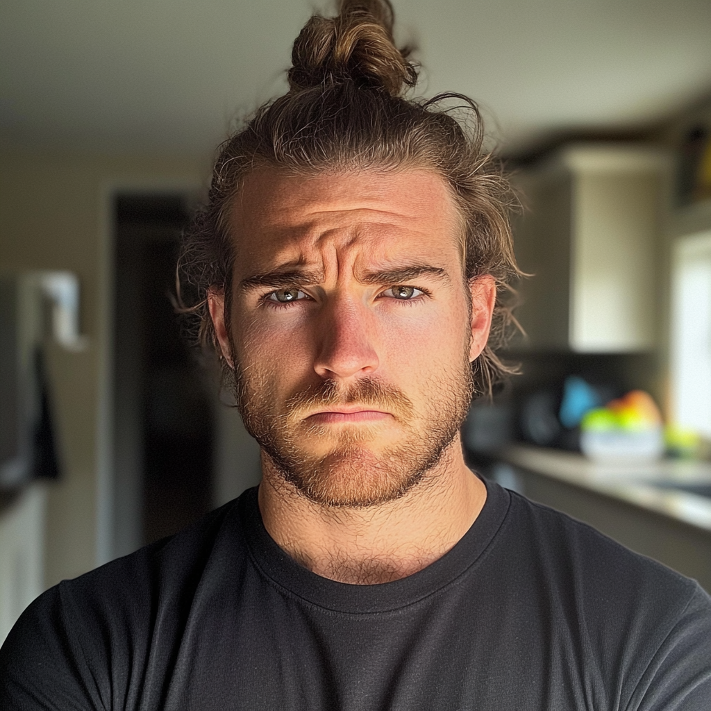 A frowning man in a kitchen | Source: Midjourney