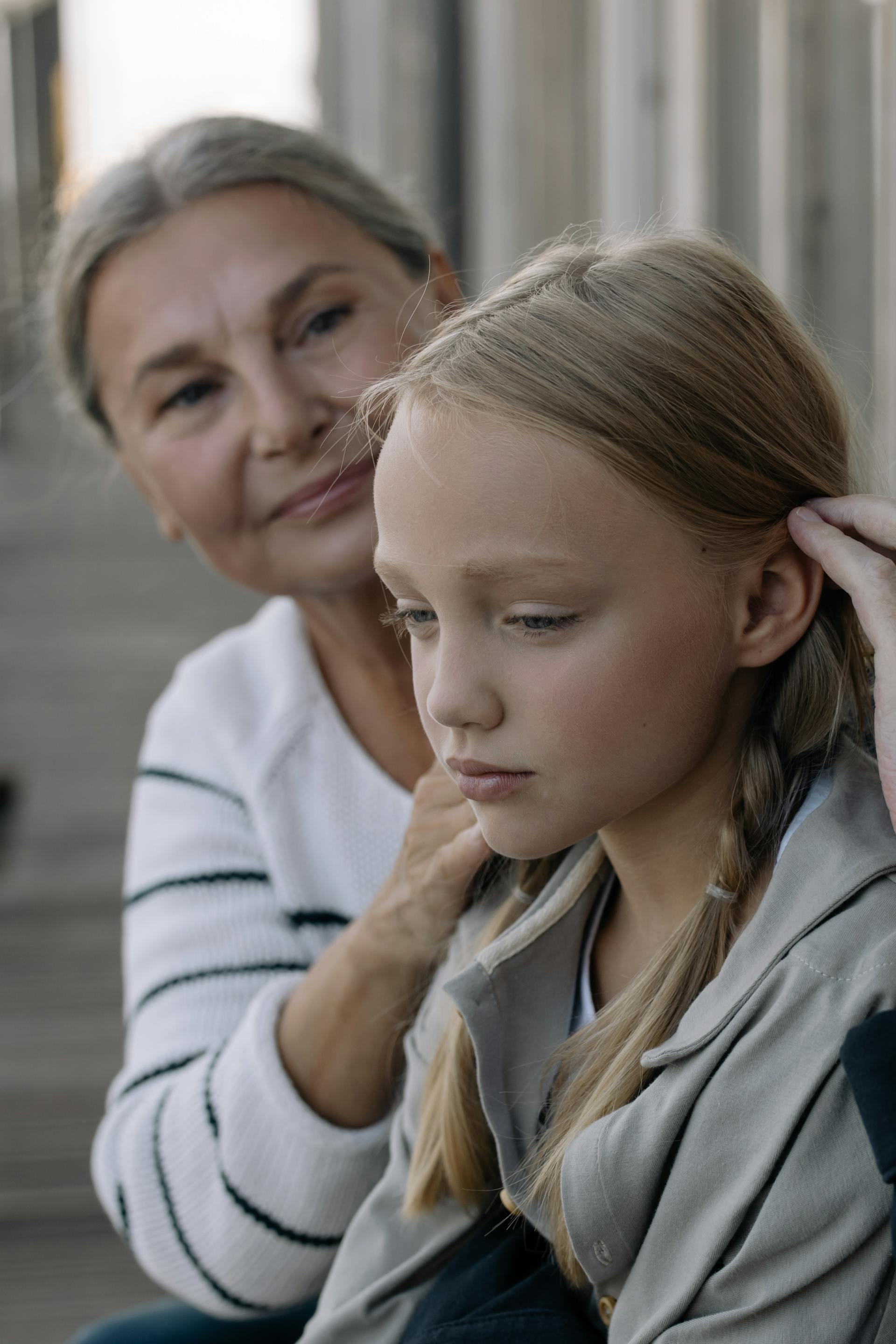 A grandmother taking care of her granddaughter | Source: Pexels