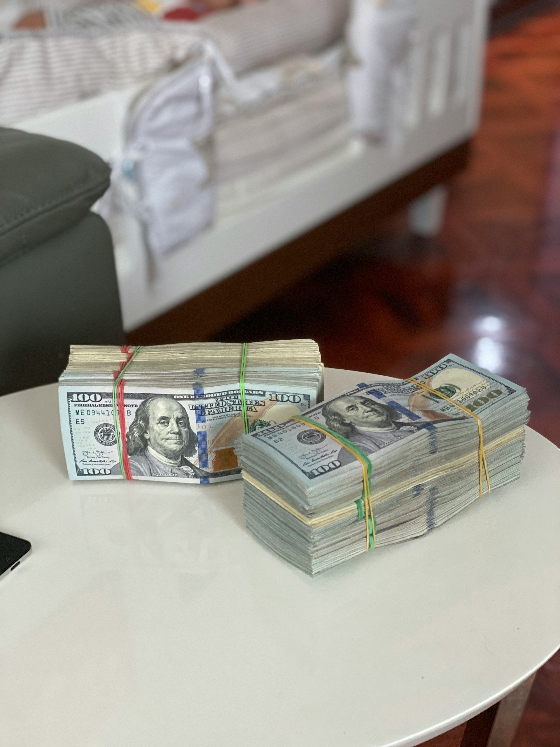 Wads of money on a table | Source: Unsplash