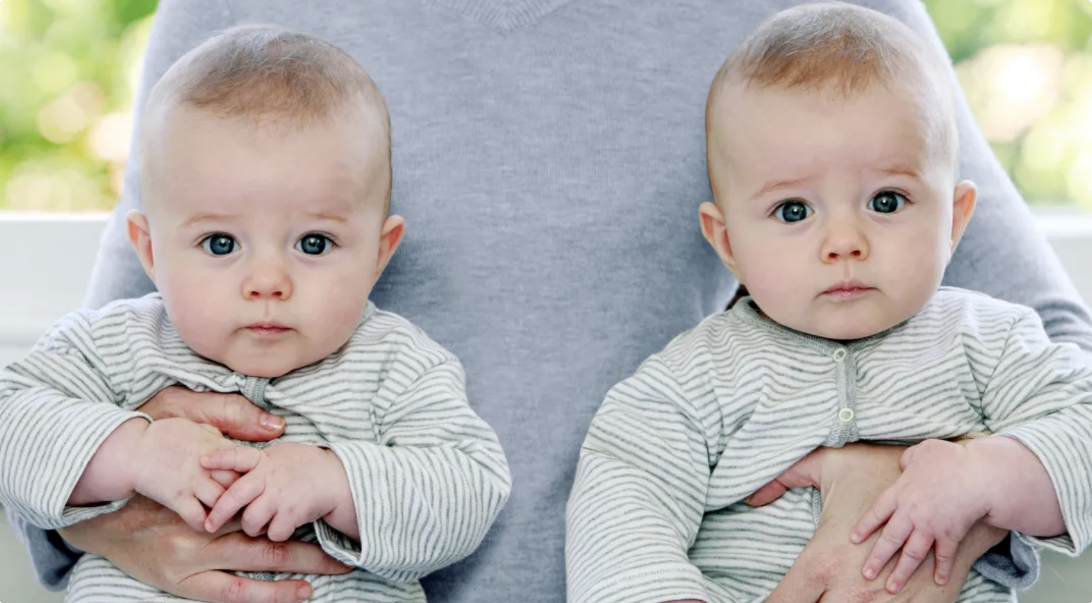 Man with two babies | Source: Shutterstock