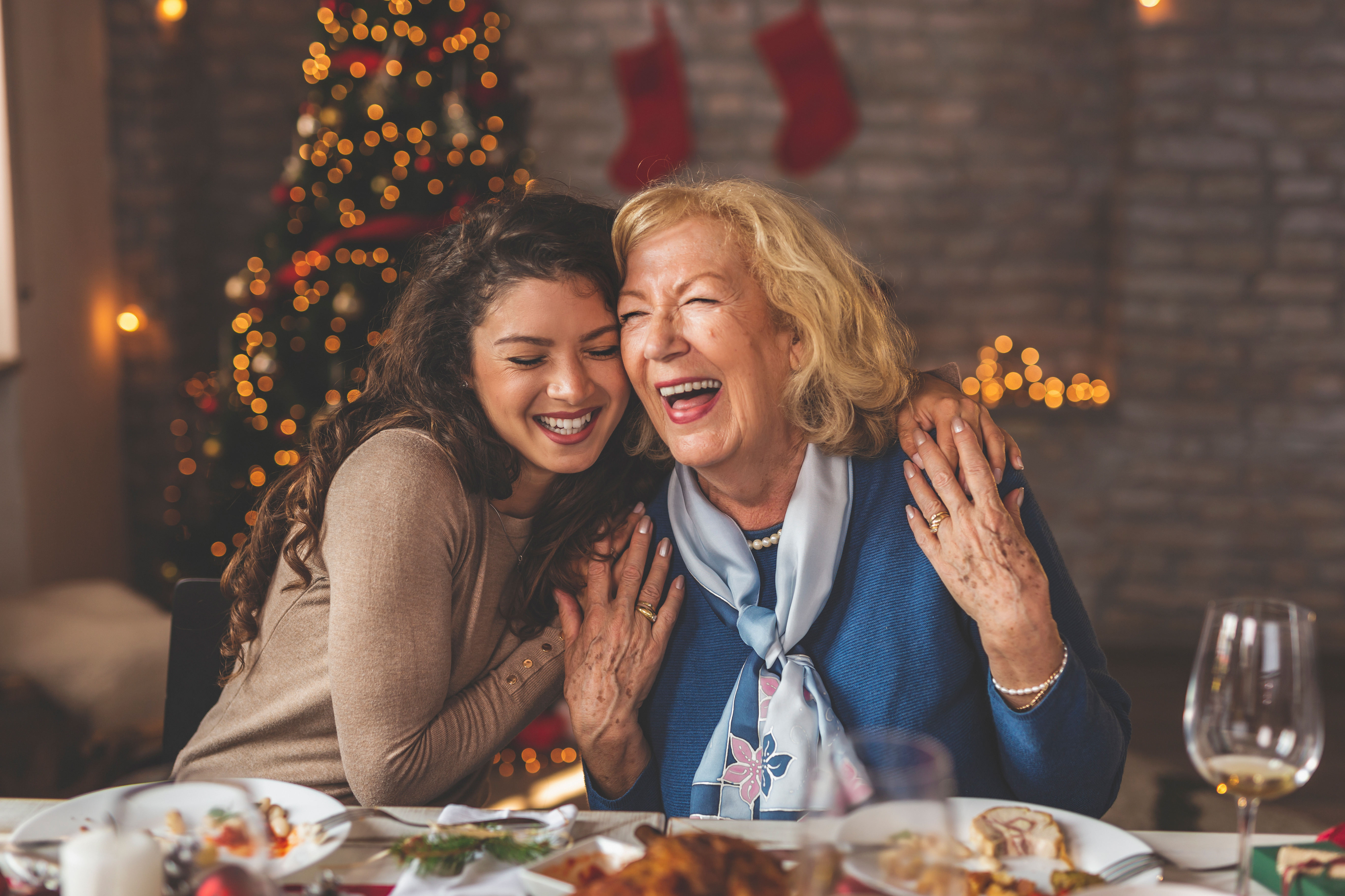 A grandmother hugging her granddaughter | Source: Shutterstock