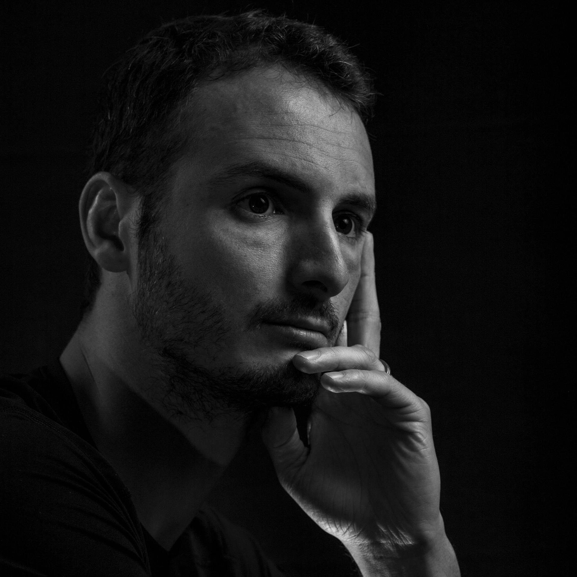 A pensive man with his hand on his chin | Source: Pexels