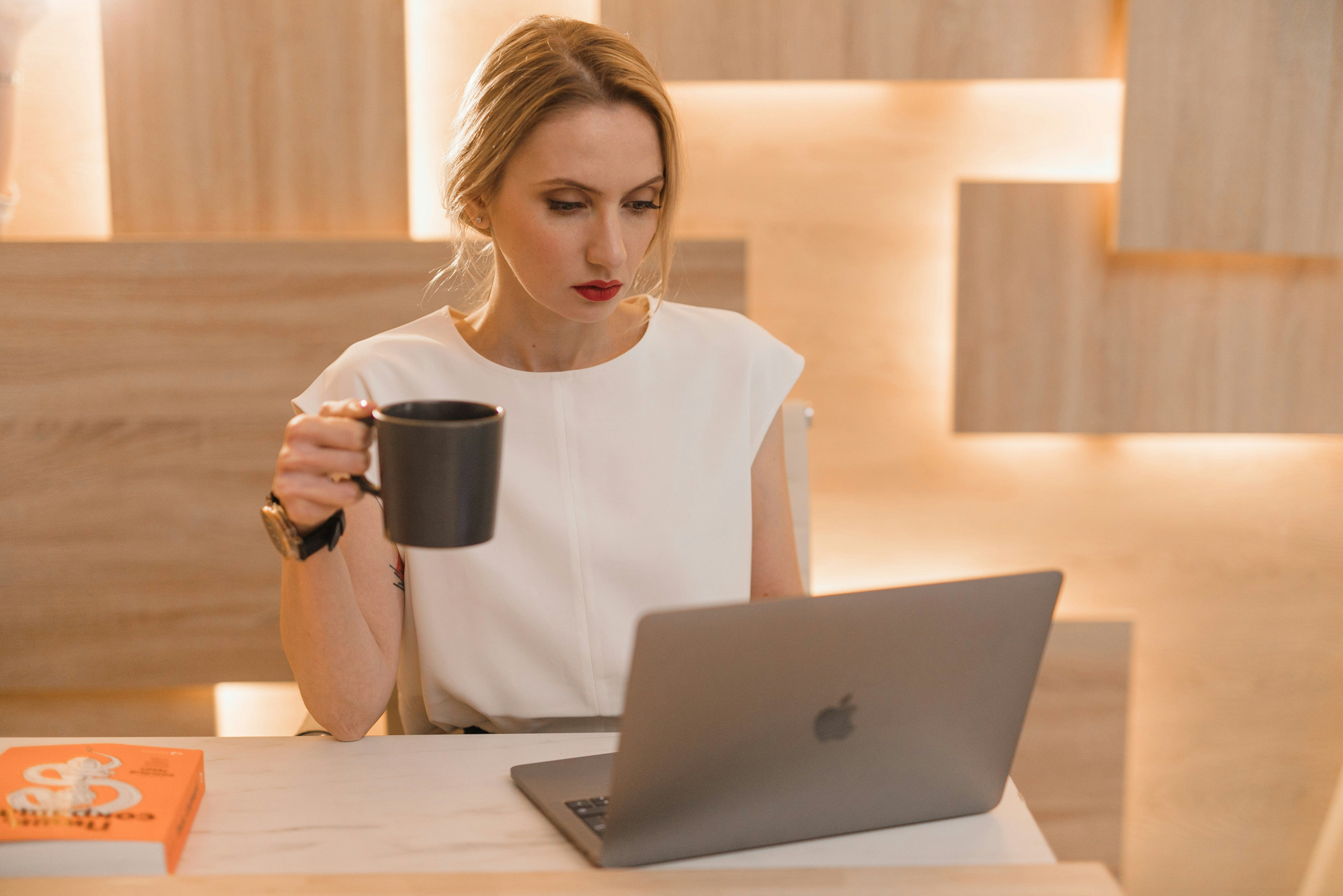 Young woman working at her laptop | Source: Unsplash