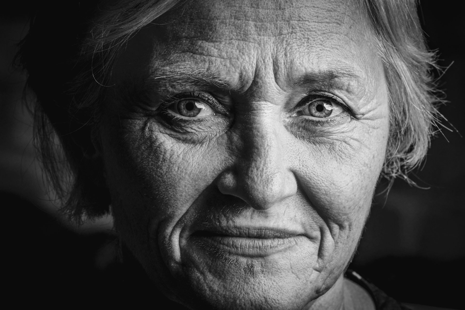Grayscale shot of an emotional woman | Source: Unsplash