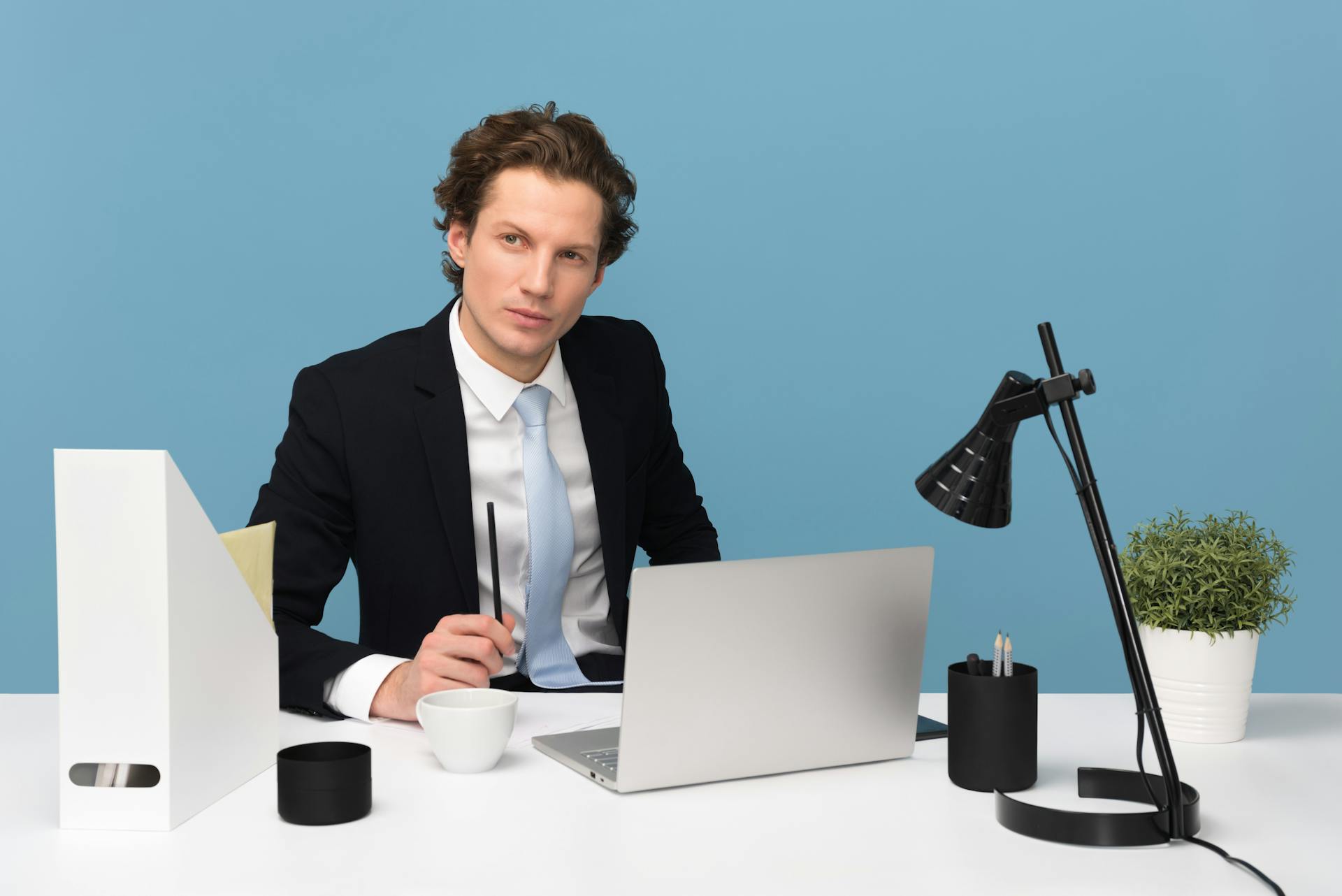 A thoughtful man seated at a desk | Source: Pexels