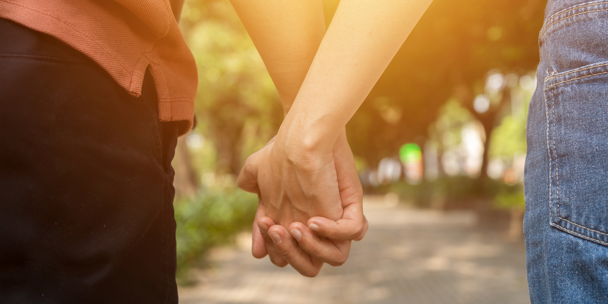 A couple holding hands | Source: Shutterstock