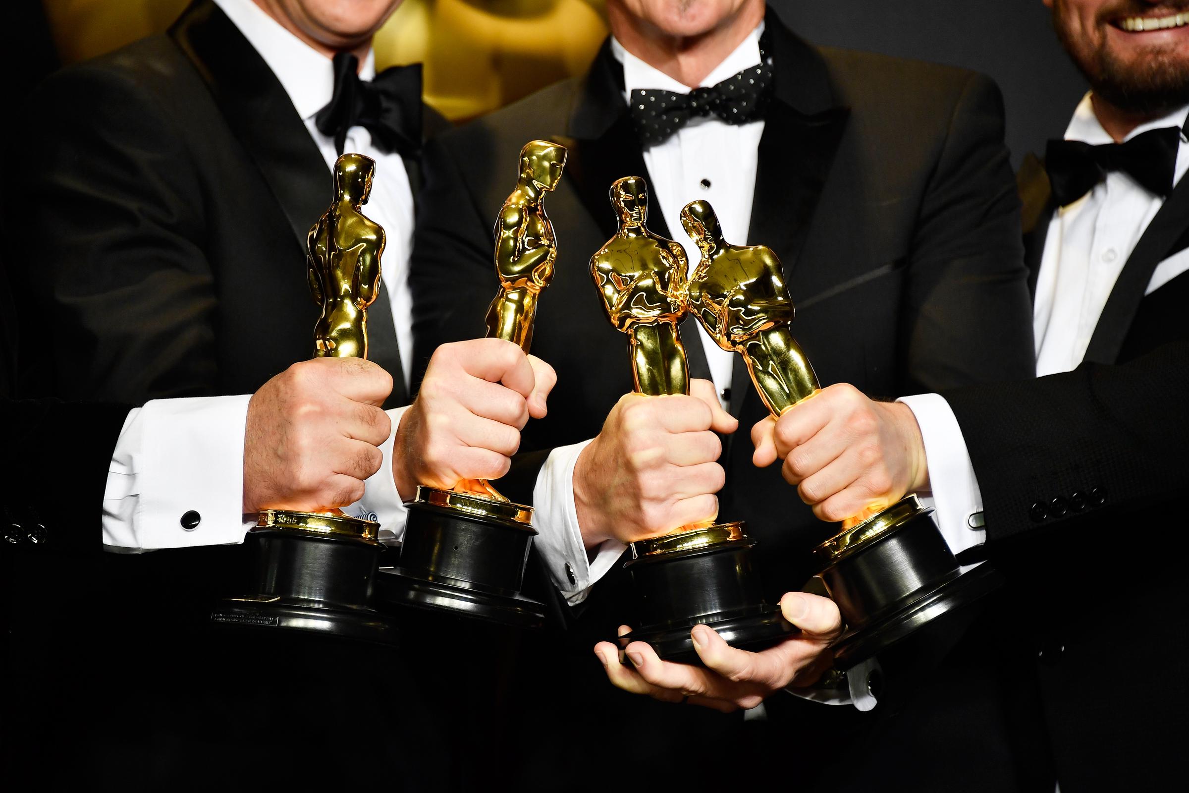 Sound mixers Peter Grace, Robert Mackenzie, Kevin O'Connell, and Andy Wright, winners of the Best Sound Mixing award for "Hacksaw Ridge," pose in the press room during the 89th Annual Academy Awards at Hollywood & Highland Center in California on February 26, 2017. | Source: Getty Images