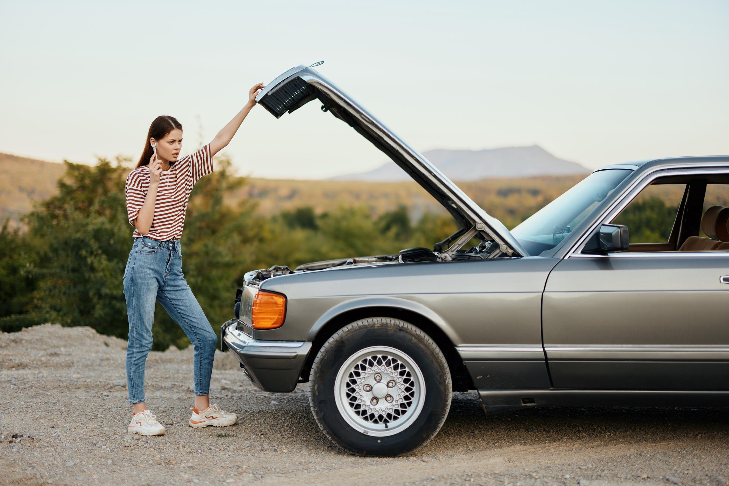 A woman standing near a car | Source: Shutterstock