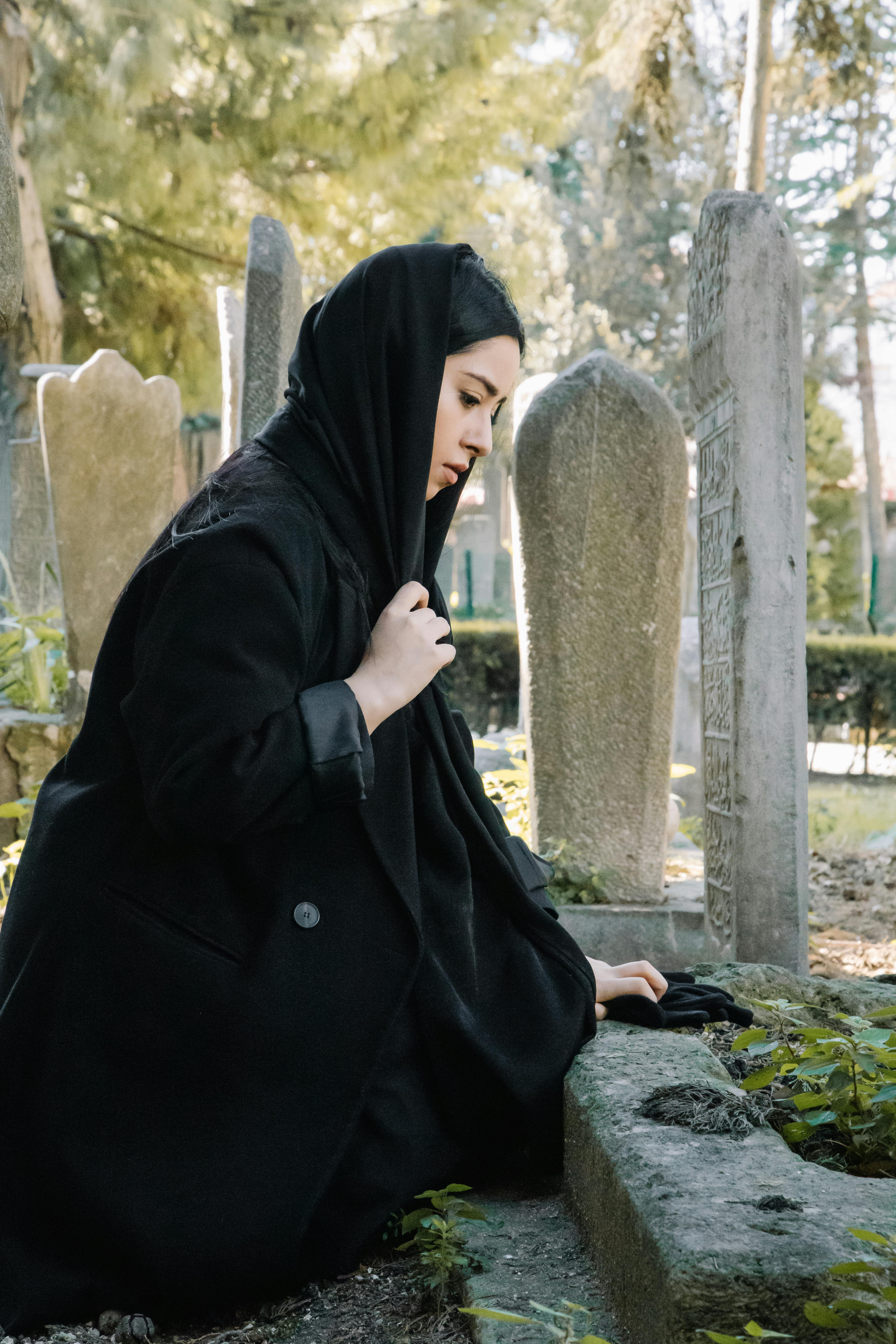 A sad young woman at a cemetery | Source: Pexels