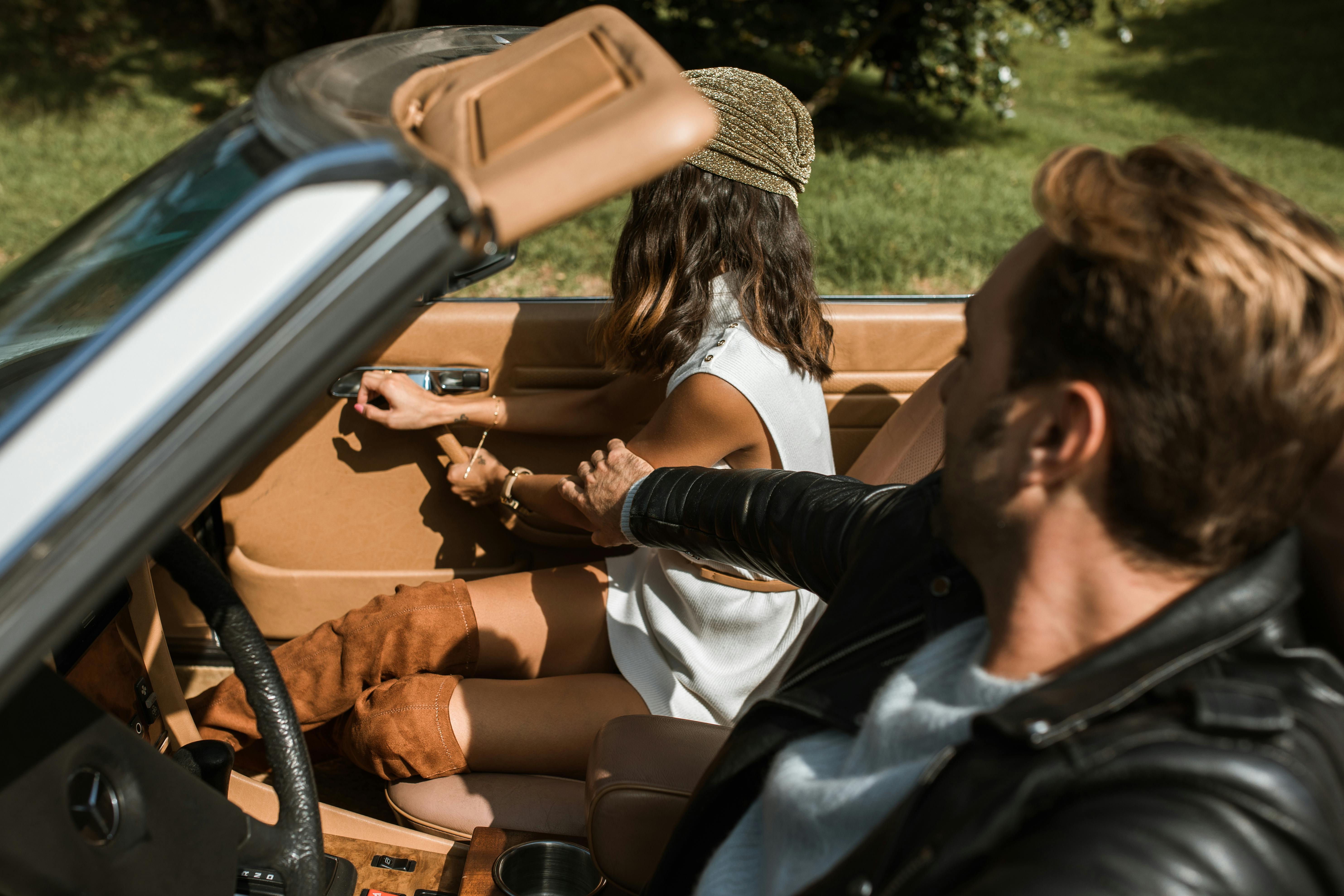 An upset woman climbing out of a car | Source: Pexels