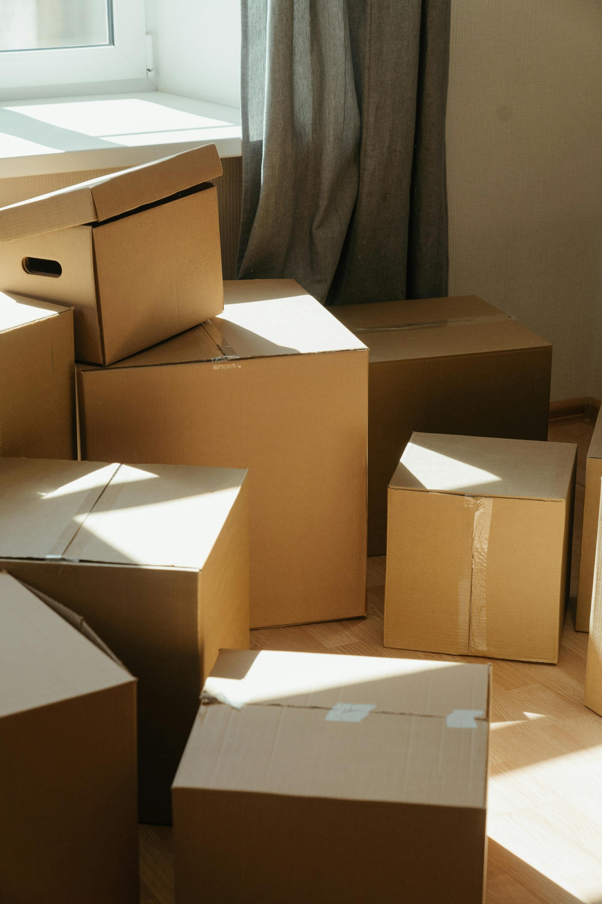 Cardboard boxes in a room | Source: Pexels
