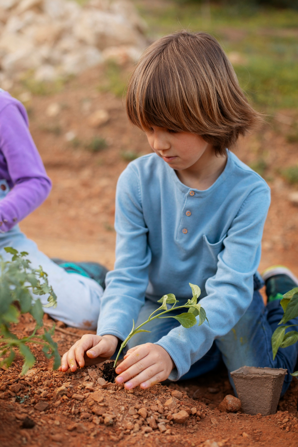 A little boy gardening | Source: Freepik