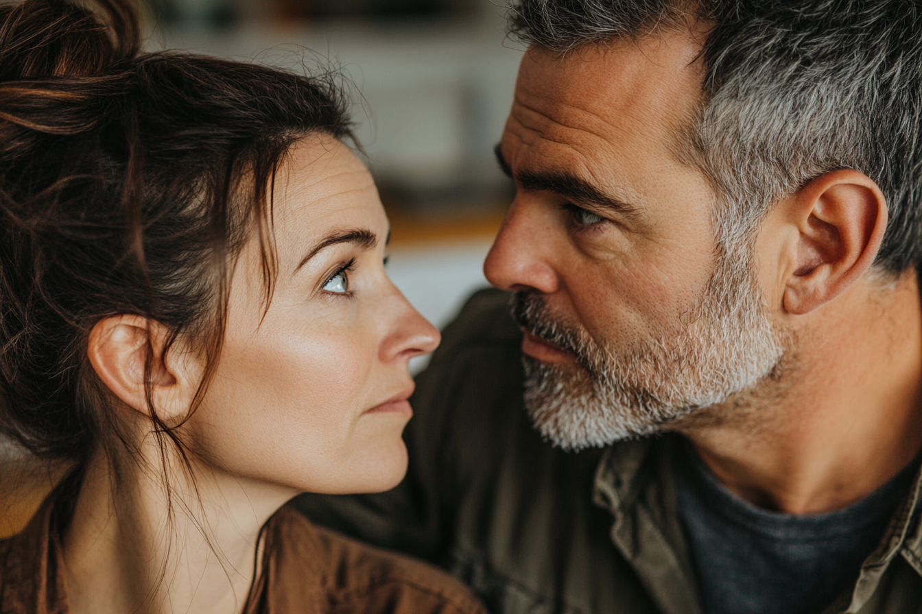 A woman shares a look with her husband | Source: Midjourney