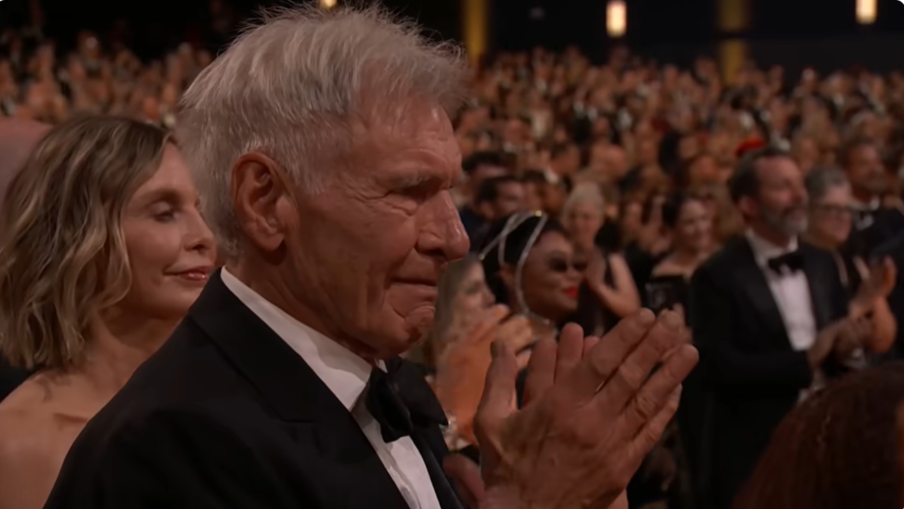 Harrison Ford applauds Michael Fox's speech during the 78th Emmy Awards ceremony. | Source: YouTube/Television Academy