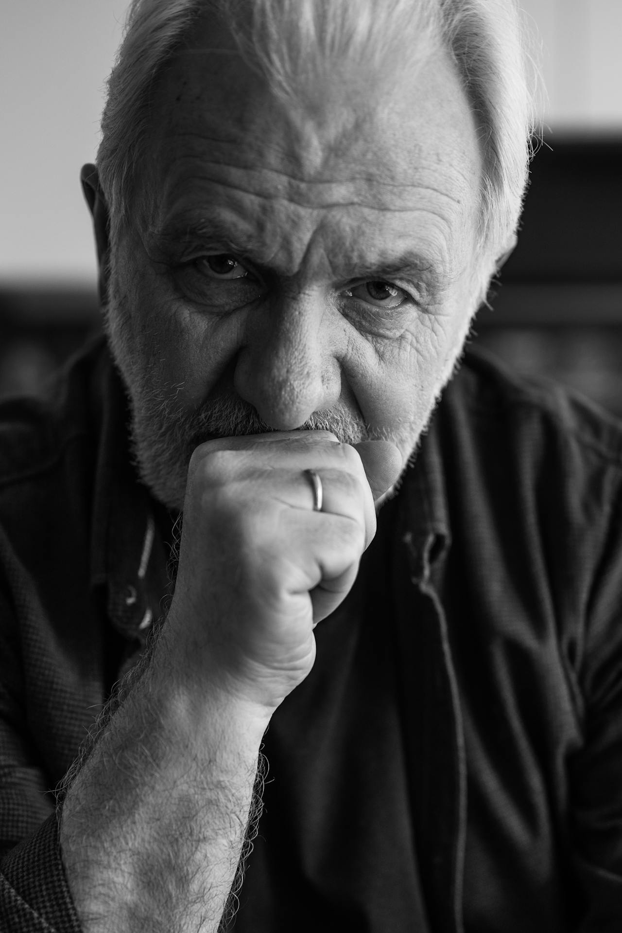 Grayscale shot of a disheartened senior man | Source: Pexels