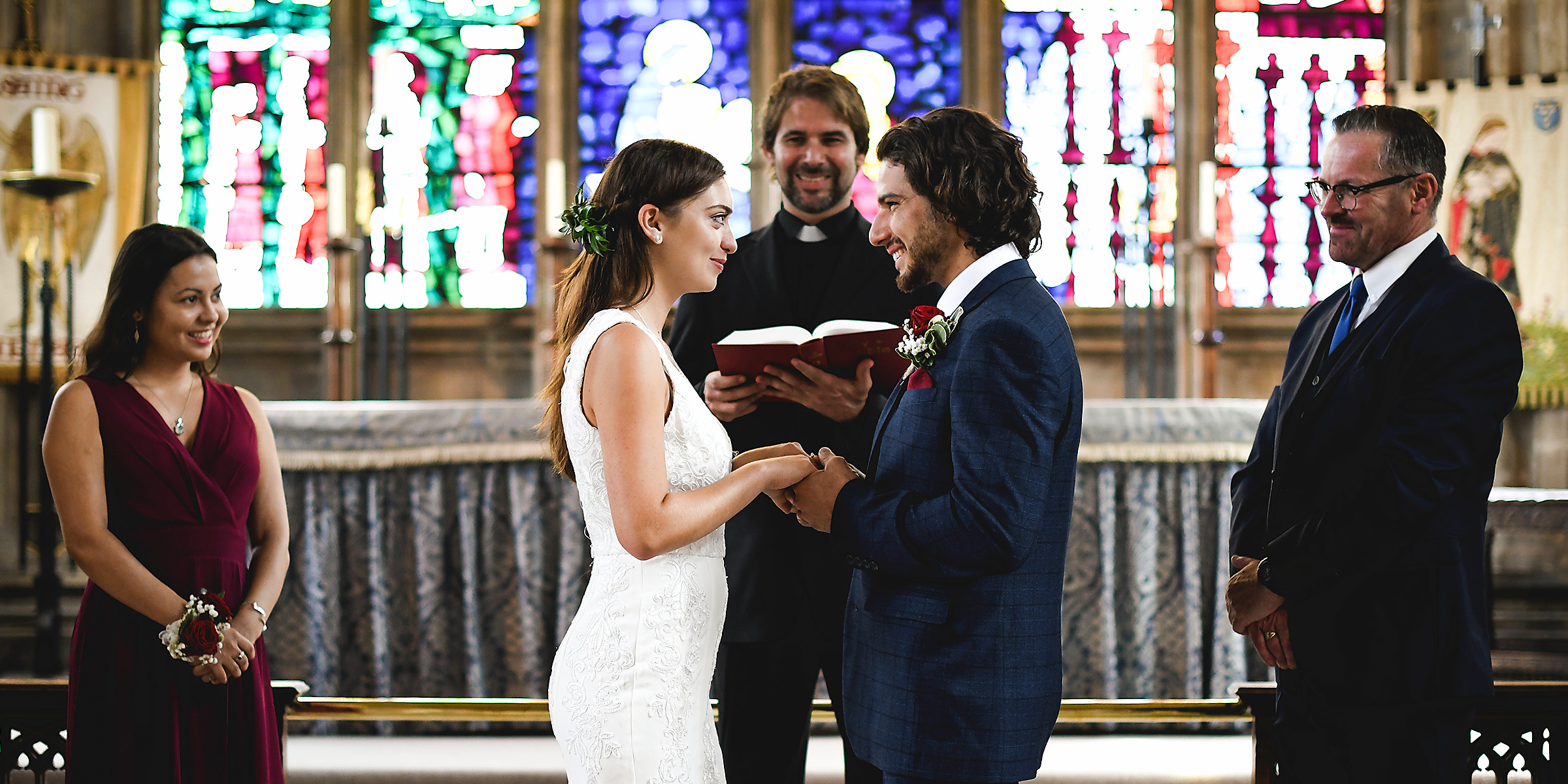 A couple standing at the altar | Source: Shutterstock