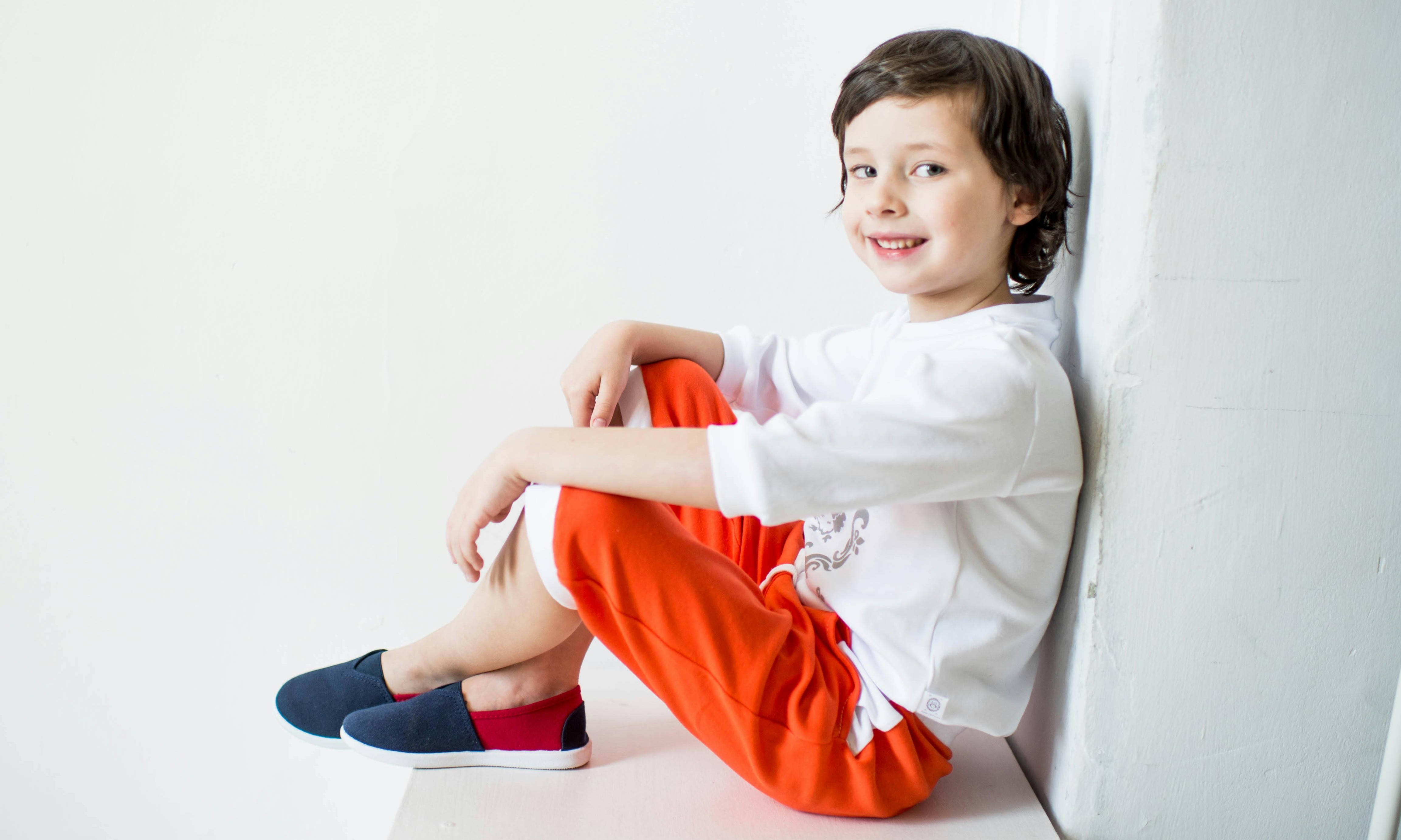 A young boy named Jason smiling innocently in the living room | Source: Pexels