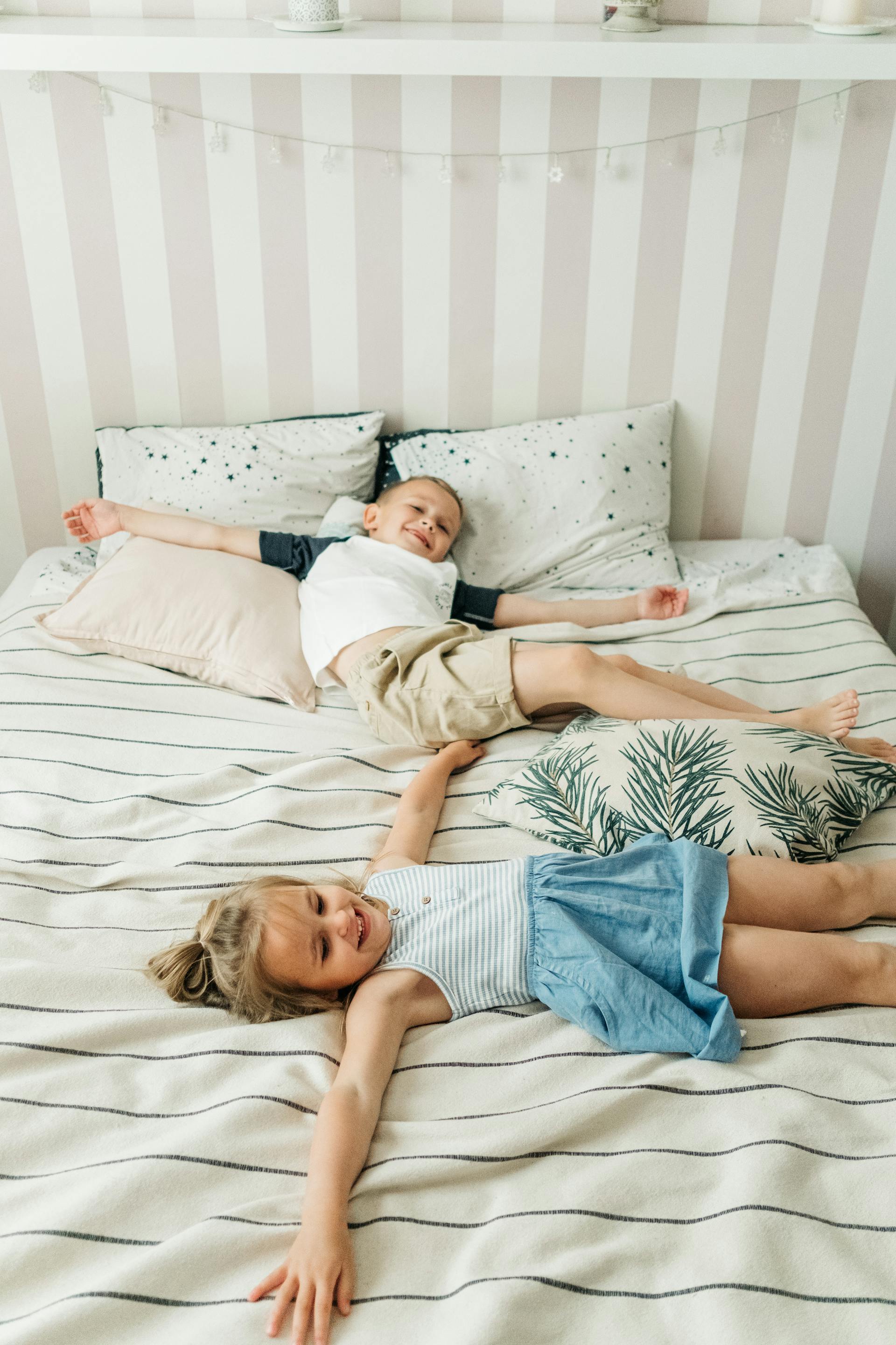Kids lying on the bed | Source: Pexels