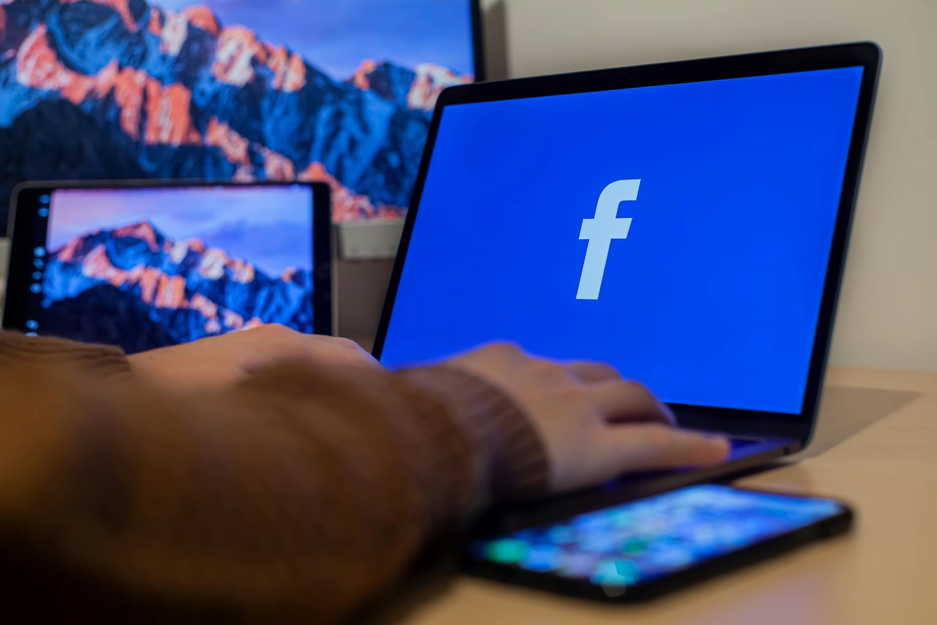A laptop displaying the Facebook logo | Source: Pexels
