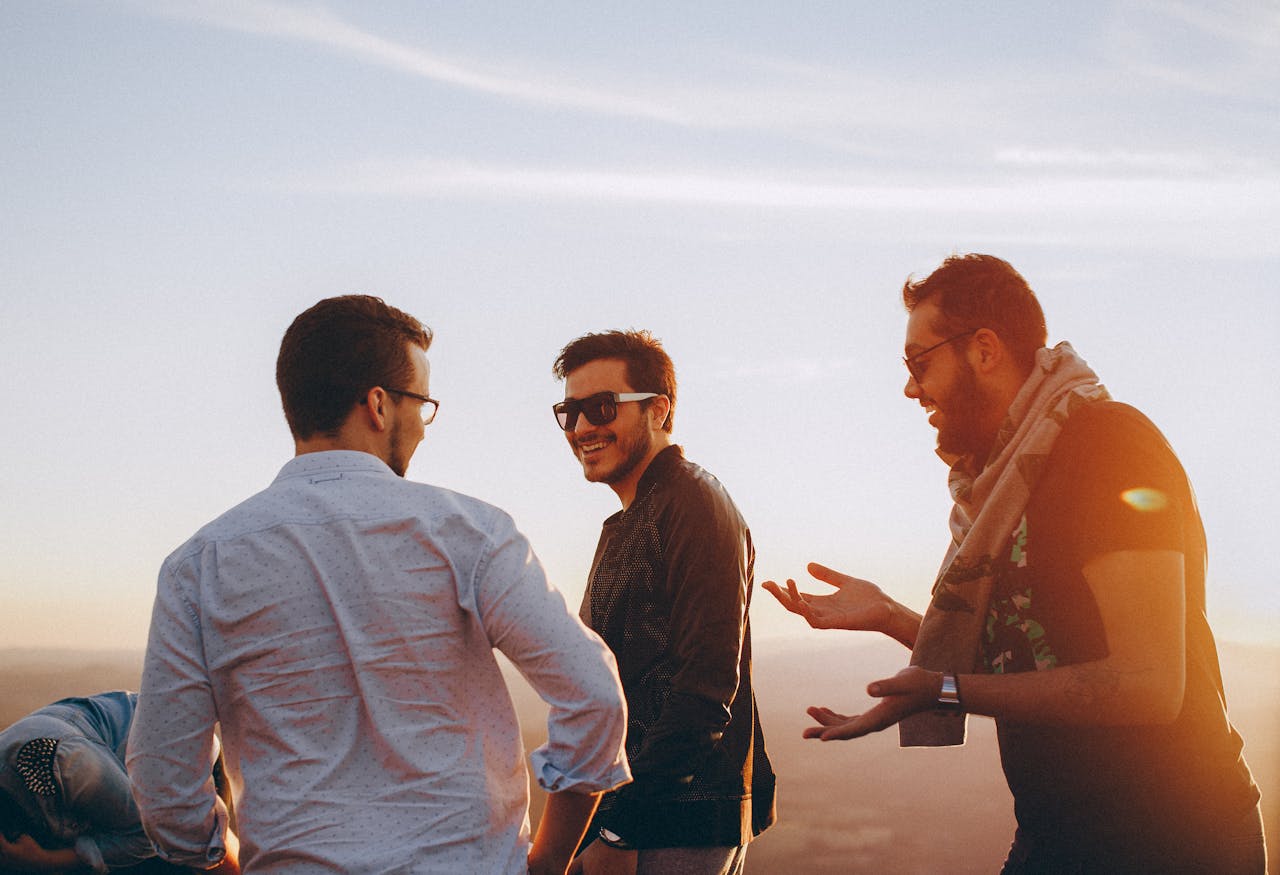 Three cheerful men laughing | Source: Pexels