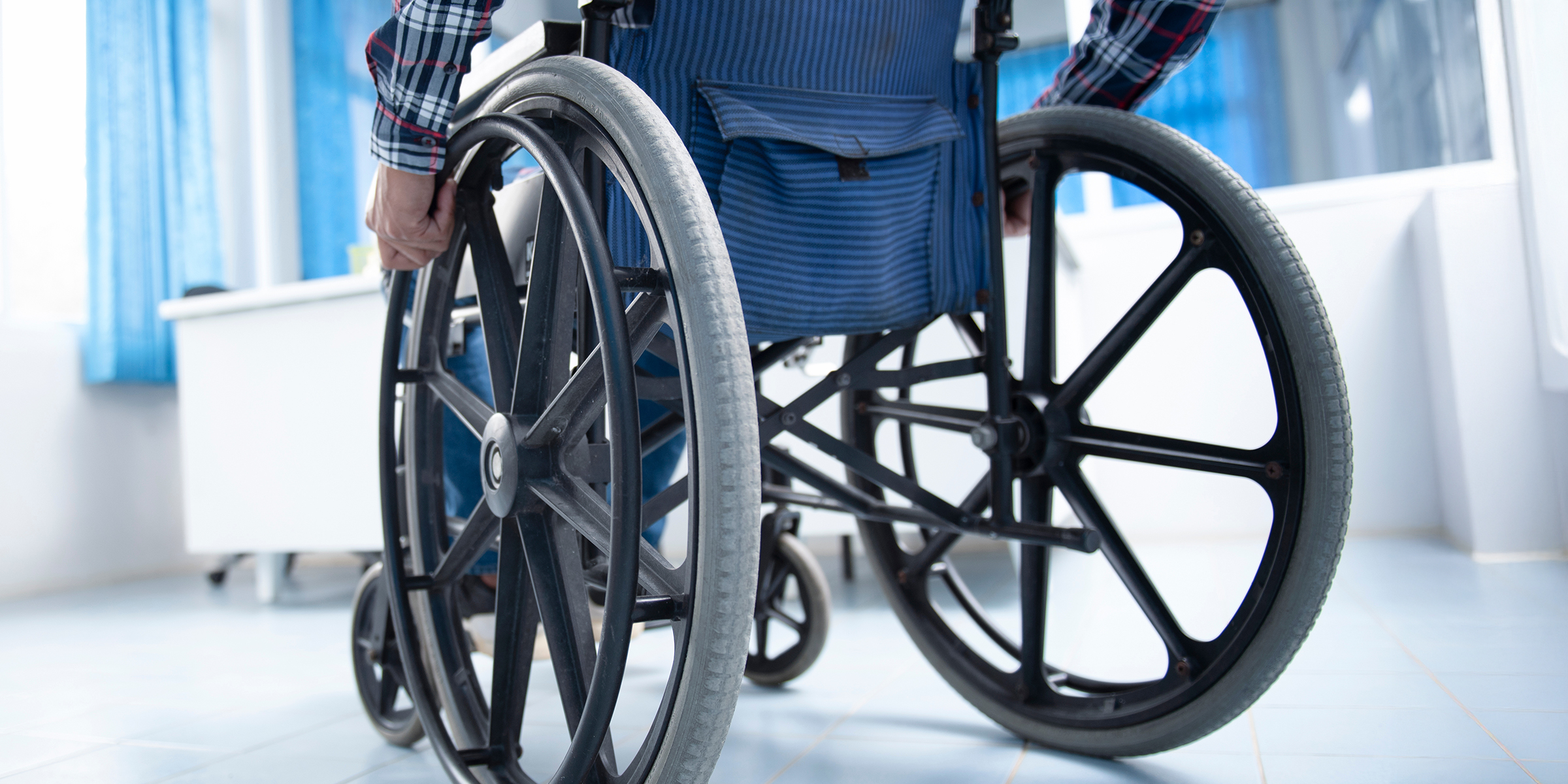 A man in a wheelchair | Source: Shutterstock