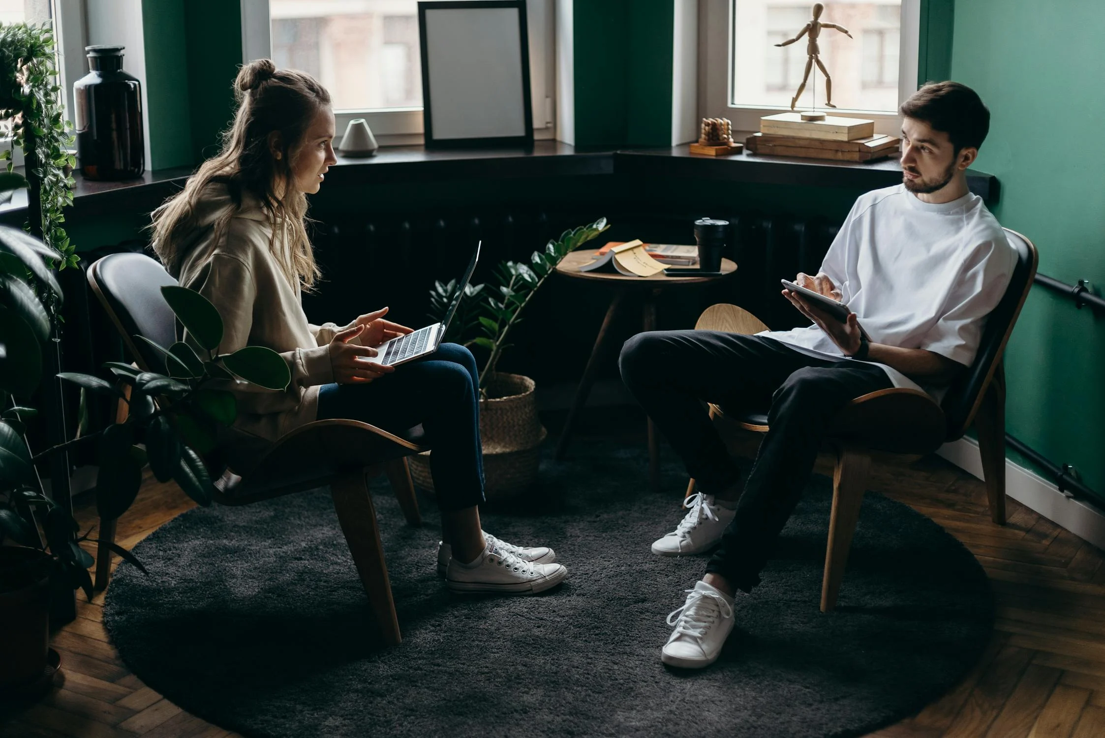 A shocked woman talking to her husband | Source: Pexels