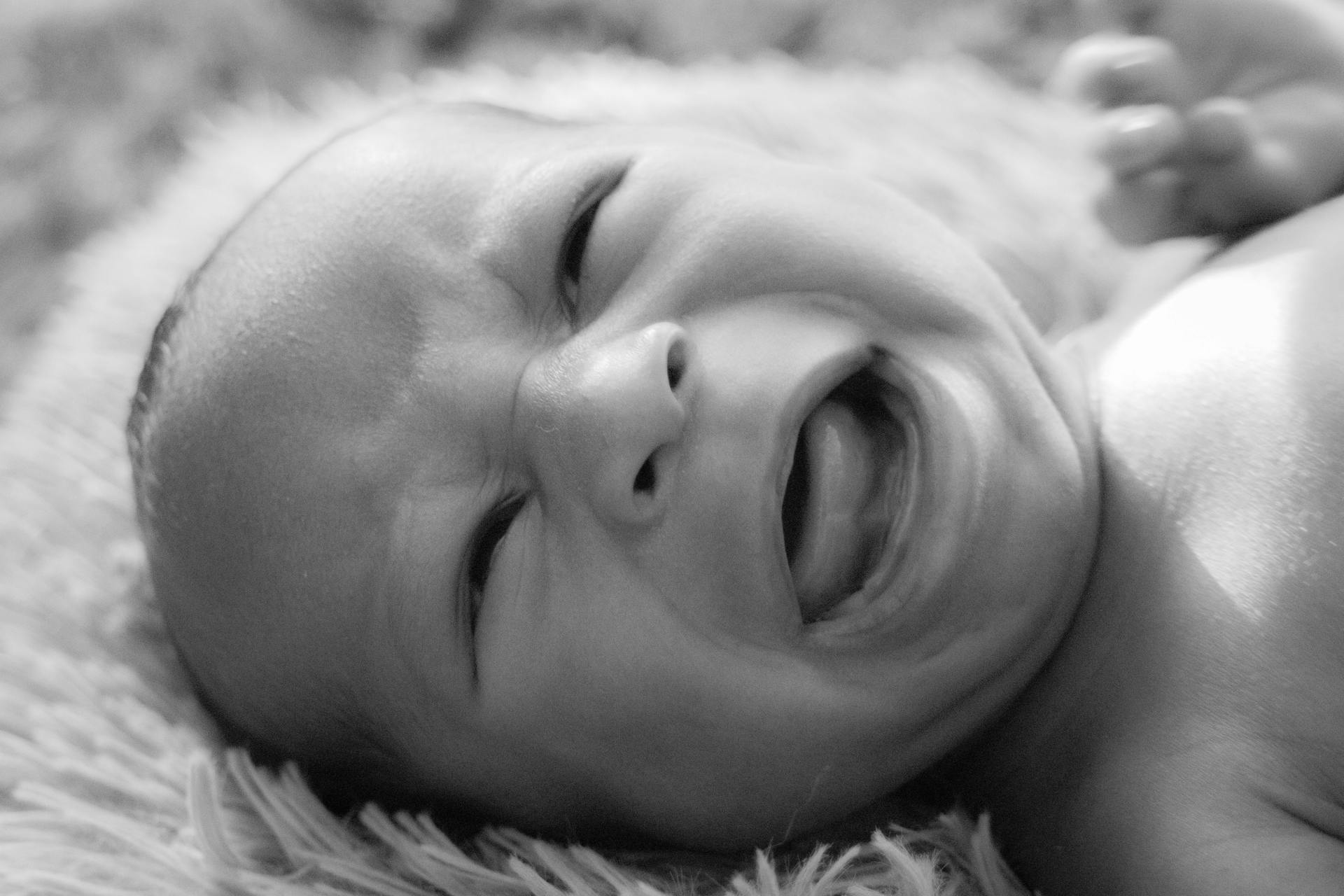 A grayscale photo of a crying baby | Source: Pexels
