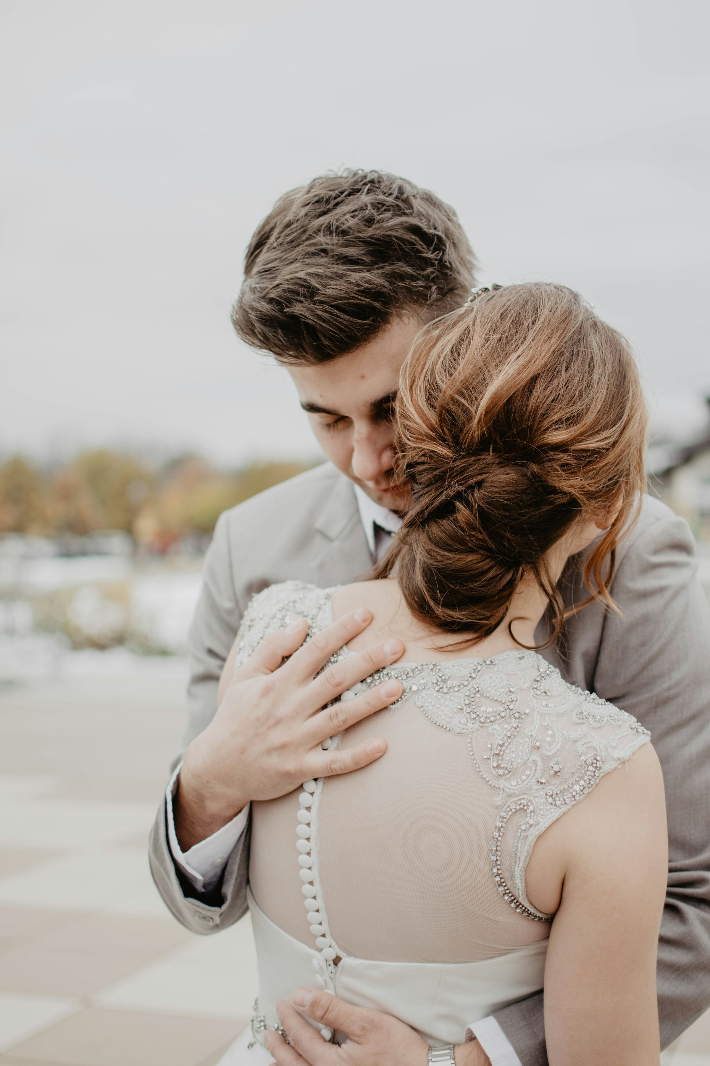 A newlywed couple hugging each other | Source: Unsplash