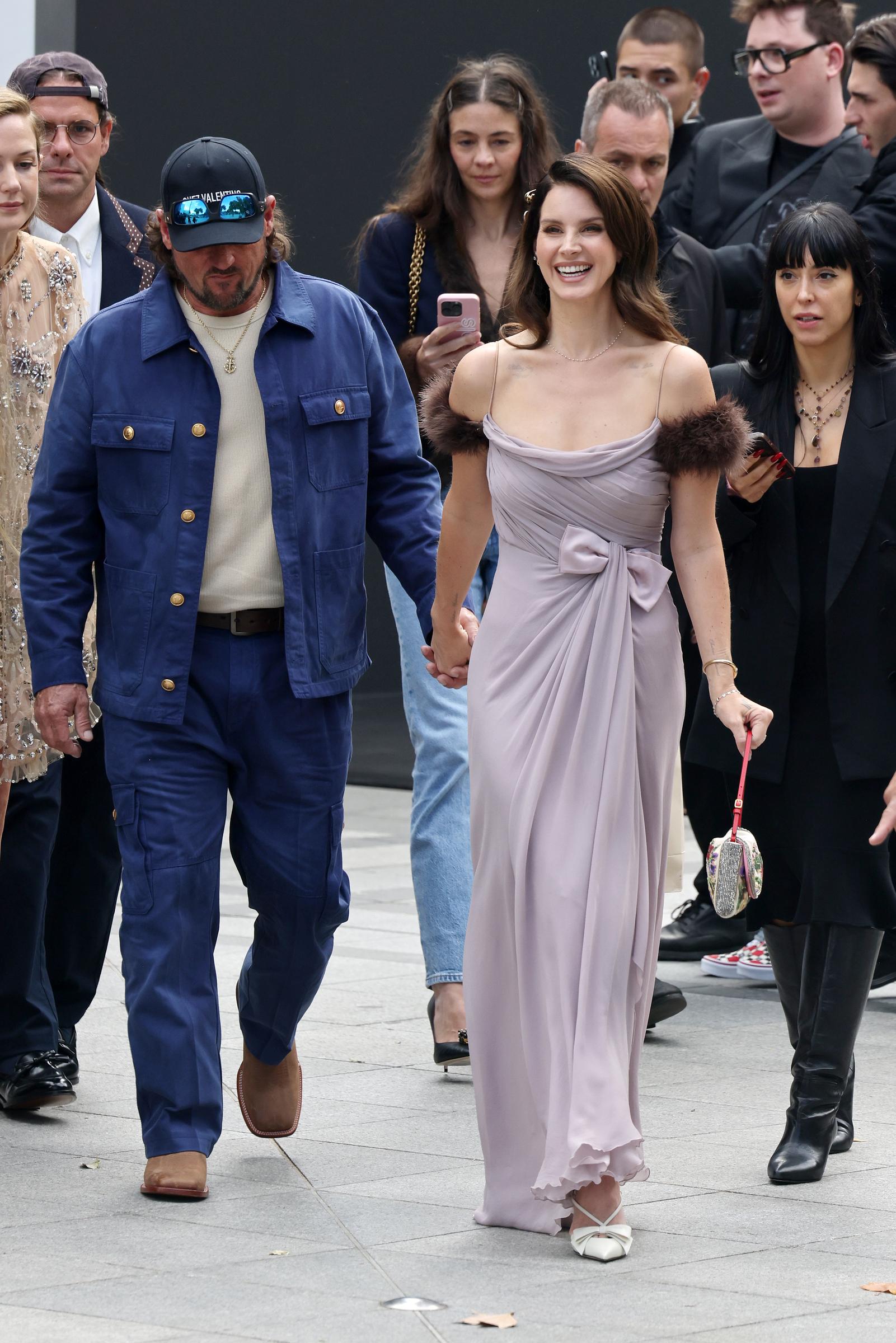 Lana Del Rey and Jeremy Dufrene arrive for the Valentino show during the Womenswear Spring Summer 2026 as part of Paris Fashion Week on October 5, 2025, in Paris, France. | Source: Getty Images