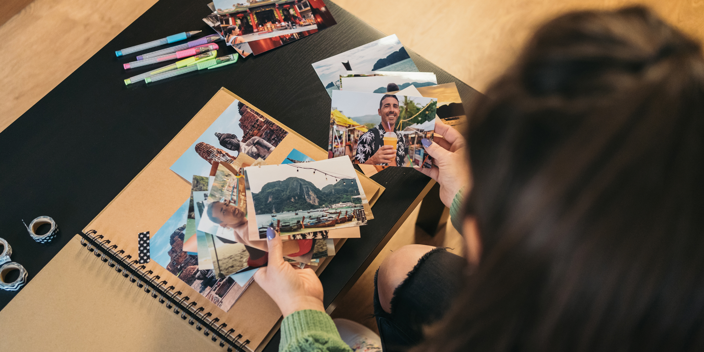 A woman holding photographs | Source: Shutterstock