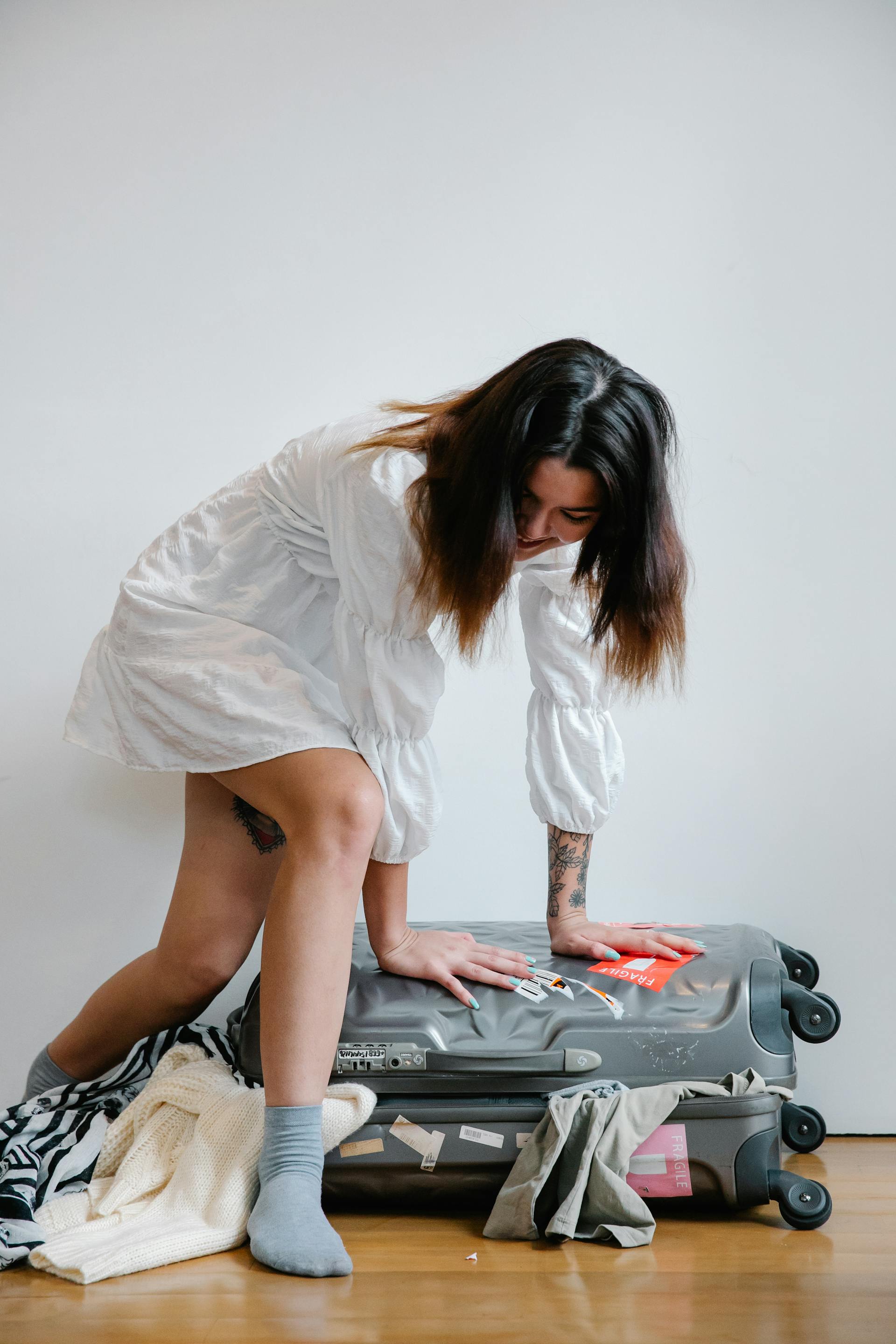 My Stepfather Told My Mom She Didn't Need Pretty Clothes Anymore – It Was His Biggest Mistake 14 A woman packing luggage | Source: Pexels