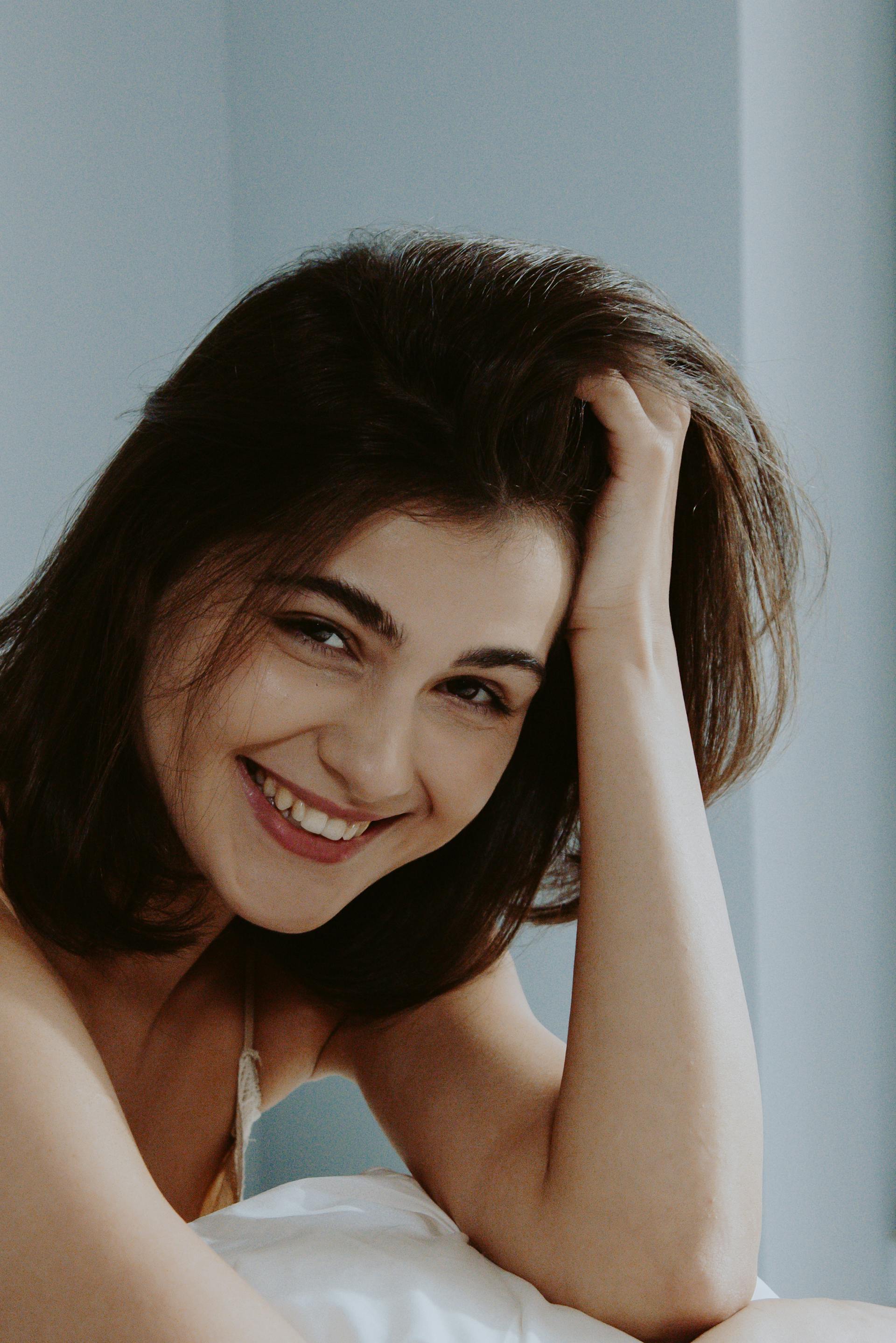 A woman smiling at someone | Source: Pexels