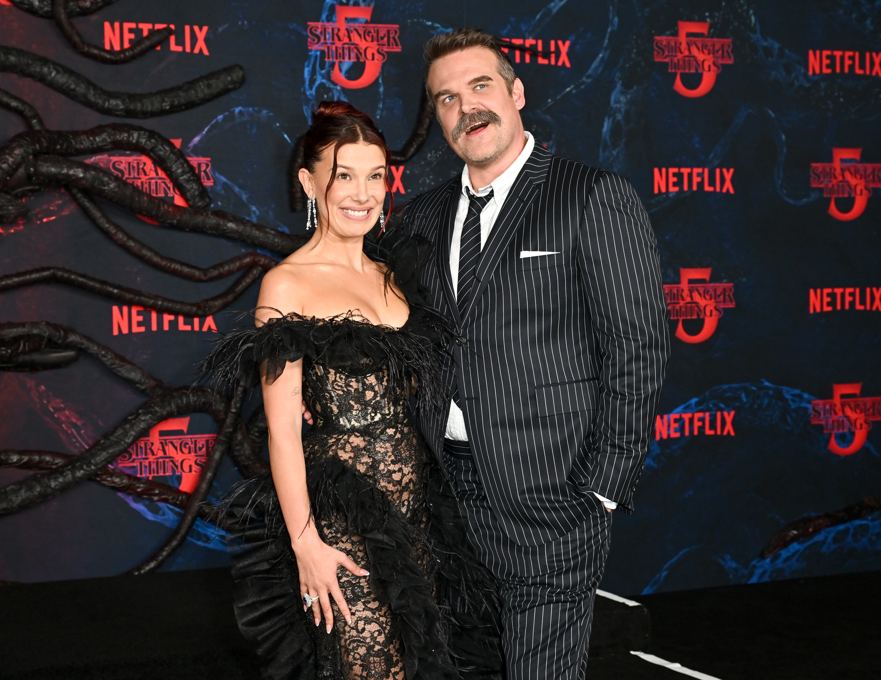 Millie Bobby Brown and David Harbour at the "Stranger Things" Season 5 World Premiere held at the TCL Chinese Theatre on November 6, 2025, in Los Angeles, California. | Source: Getty Images