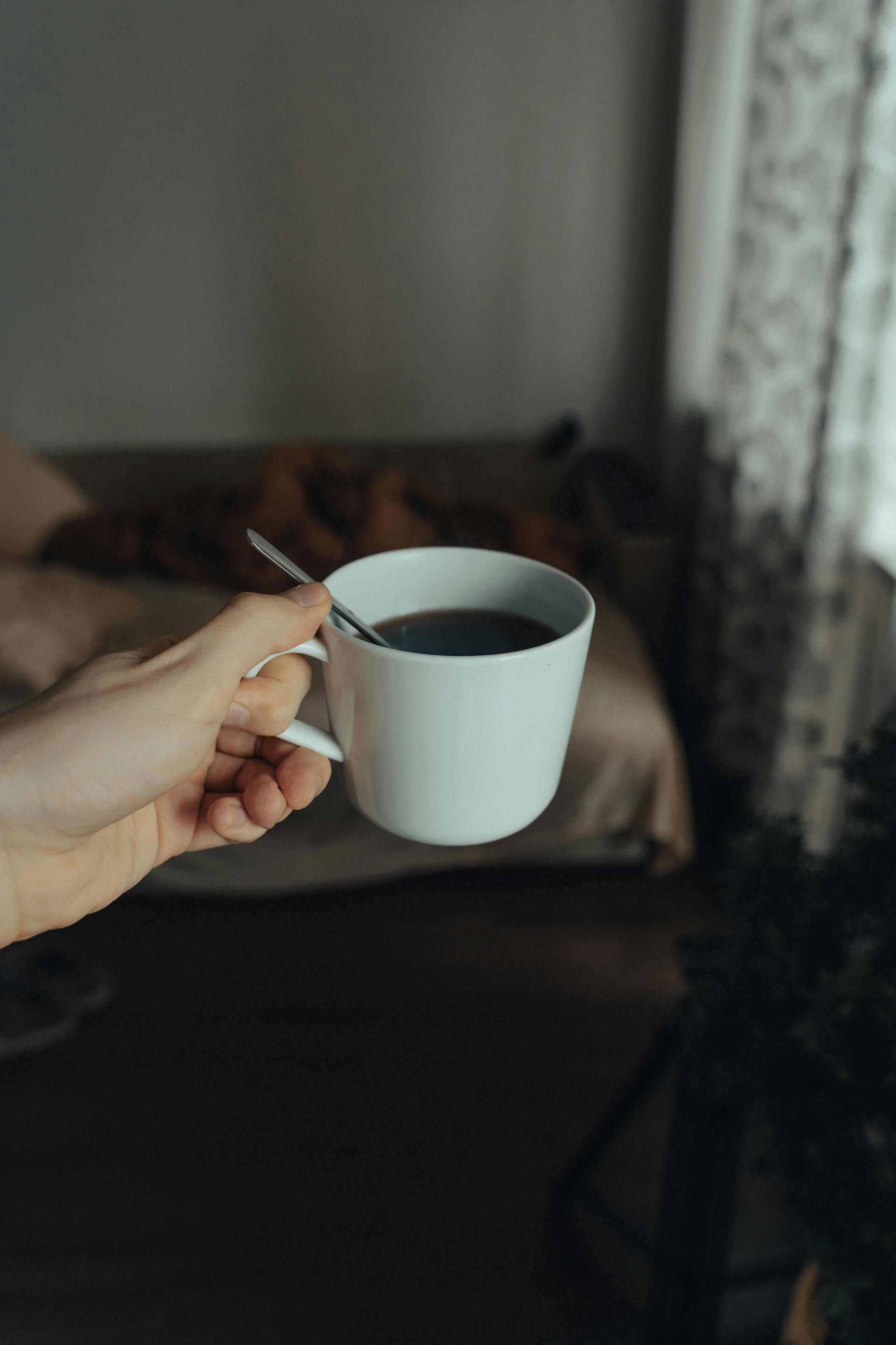 A person holding a cup of coffee | Source: Pexels