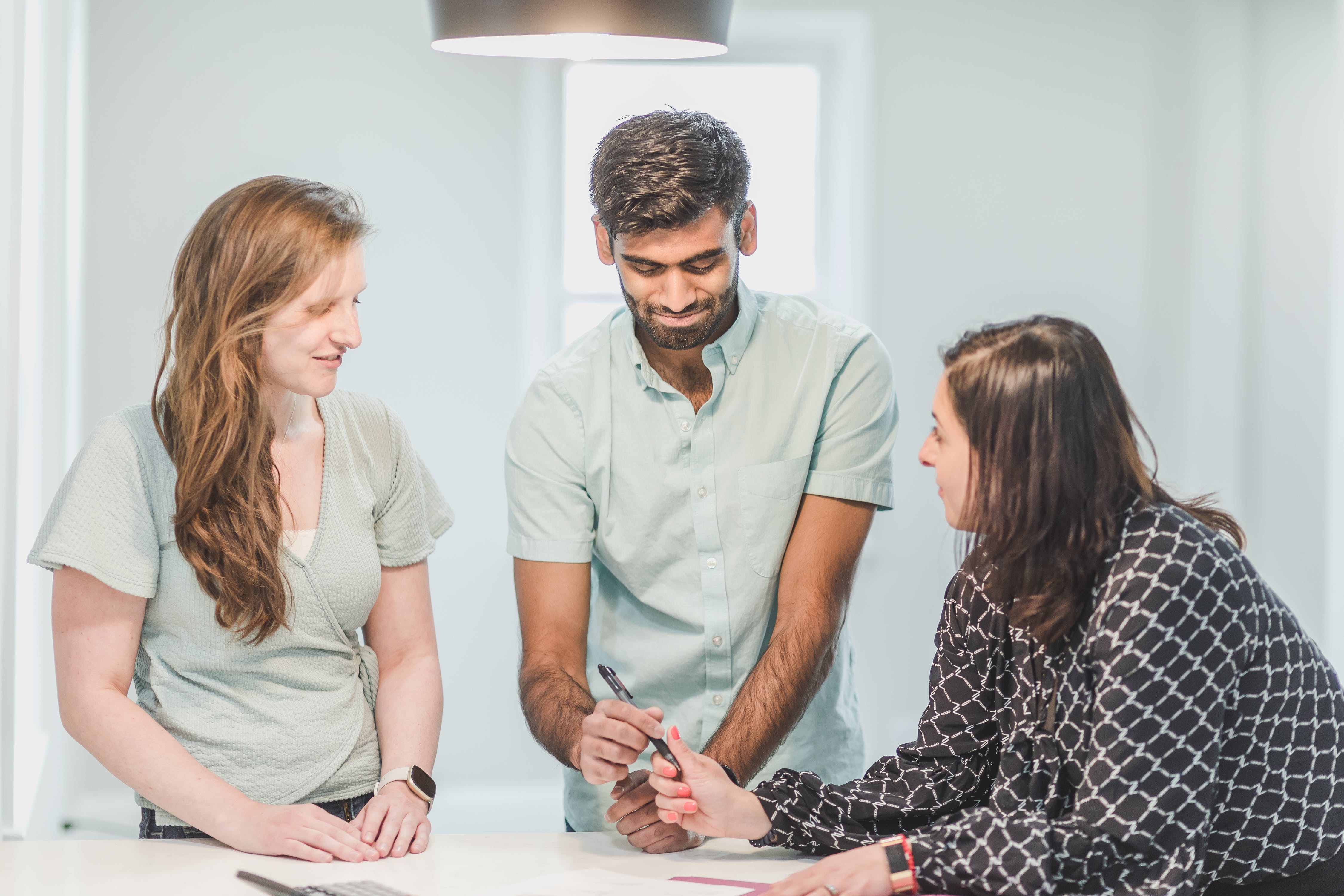 A couple arranging an agreement with a woman | Source: Pexels