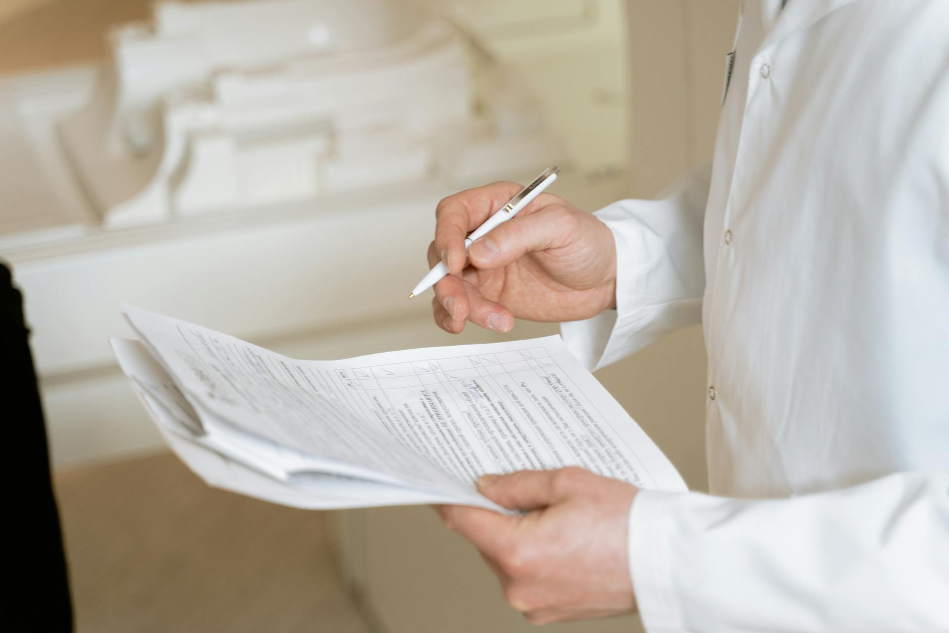 A doctor holding a test report | Source: Pexels