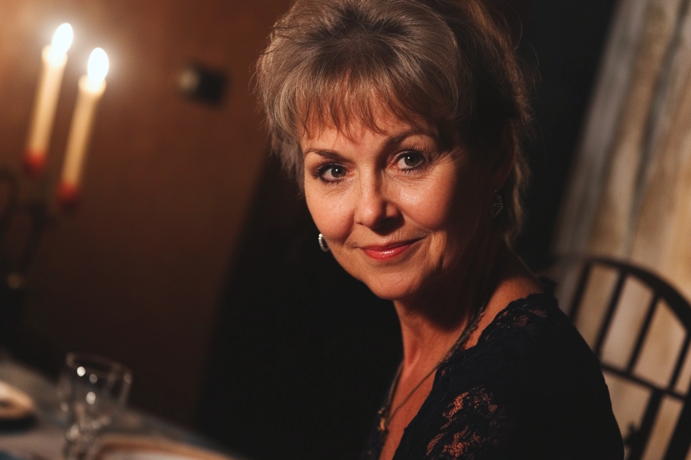 A woman at a dinner table smiling | Source: Midjourney