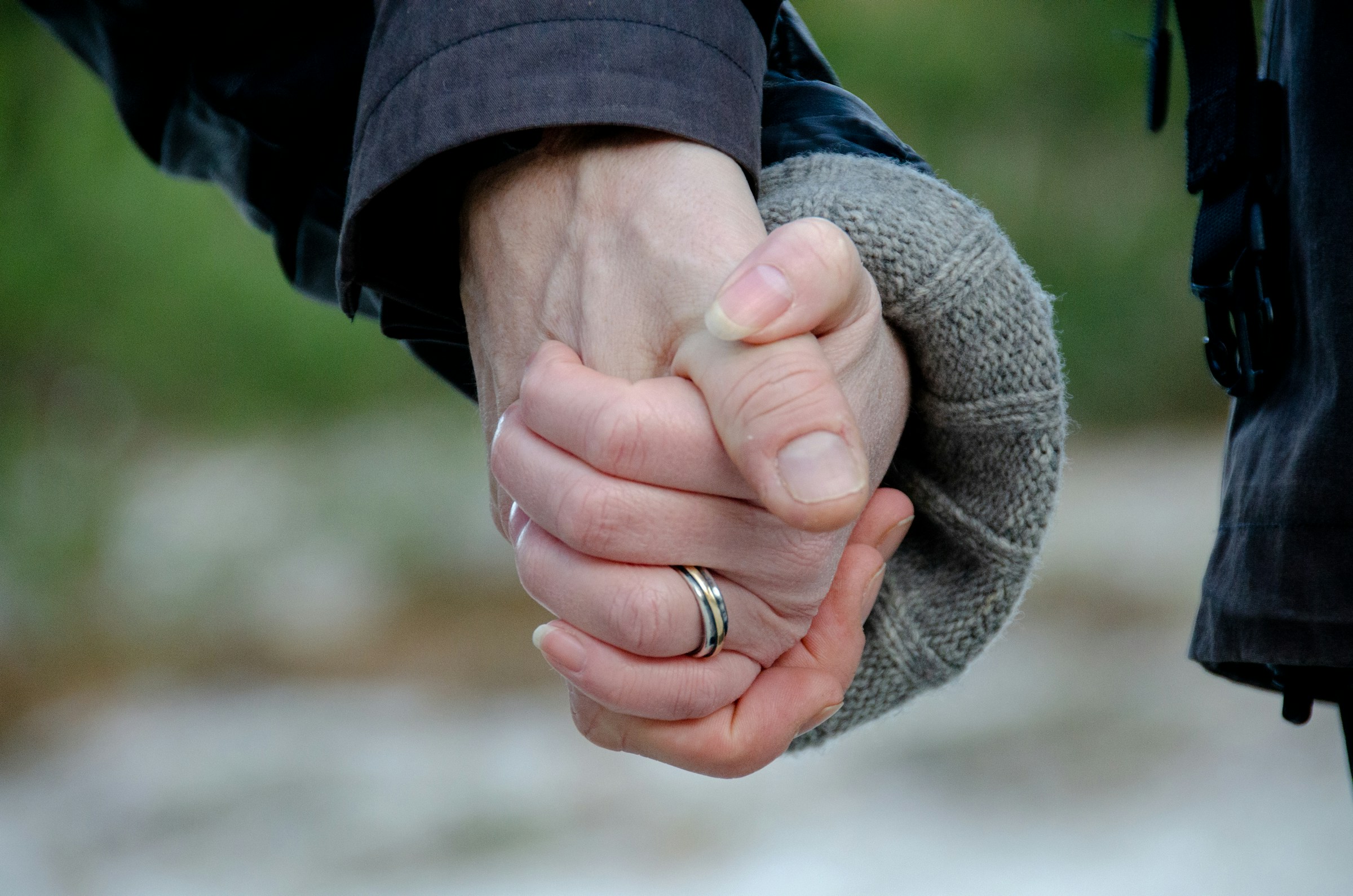 Close-up shot of a couple holding their hands | Source: Unsplash