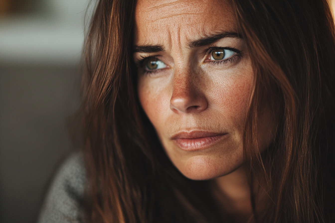 A tense woman staring at someone | Source: Midjourney