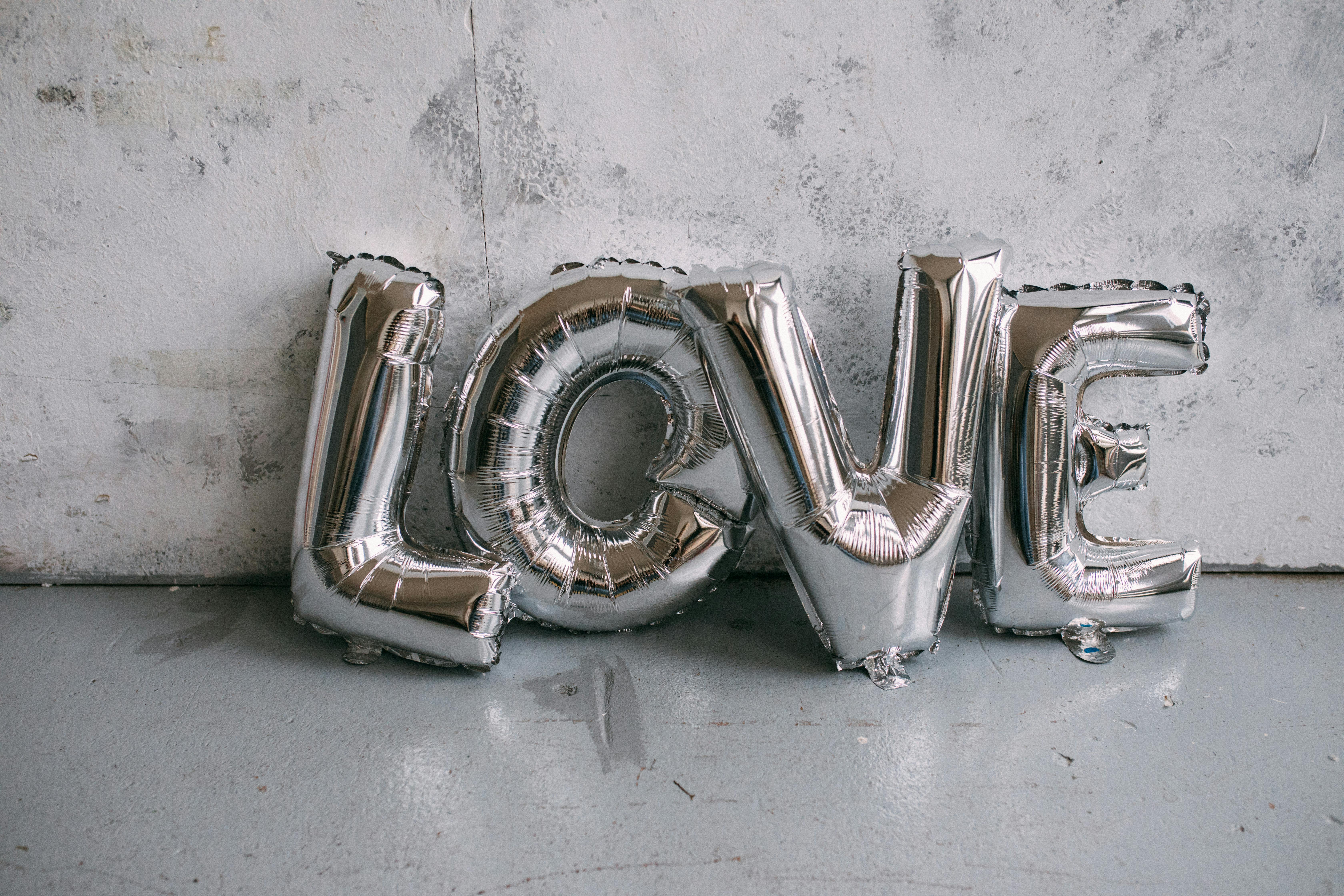 Silver letter balloons | Source: Pexels