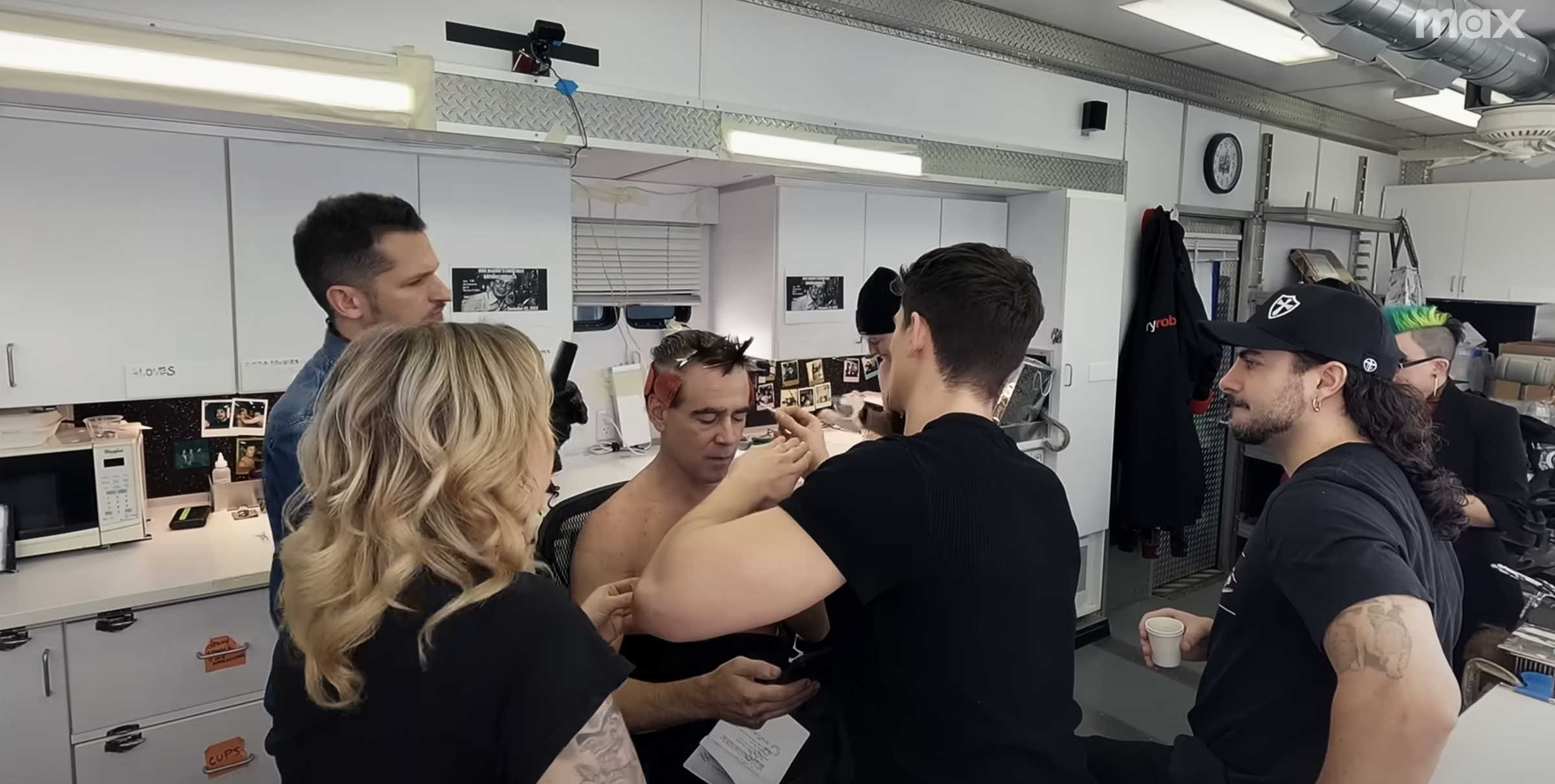 Colin Farrell seated in the makeup chair for "The Penguin," in a post dated October 7, 2024 | Source: YouTube/Max