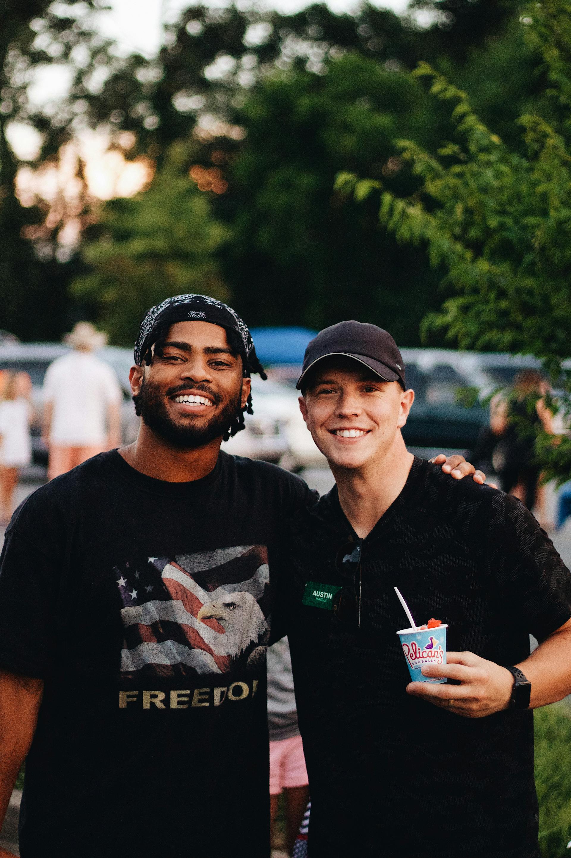 Two men are pictured at a joyful summer gathering | Source: Pexels