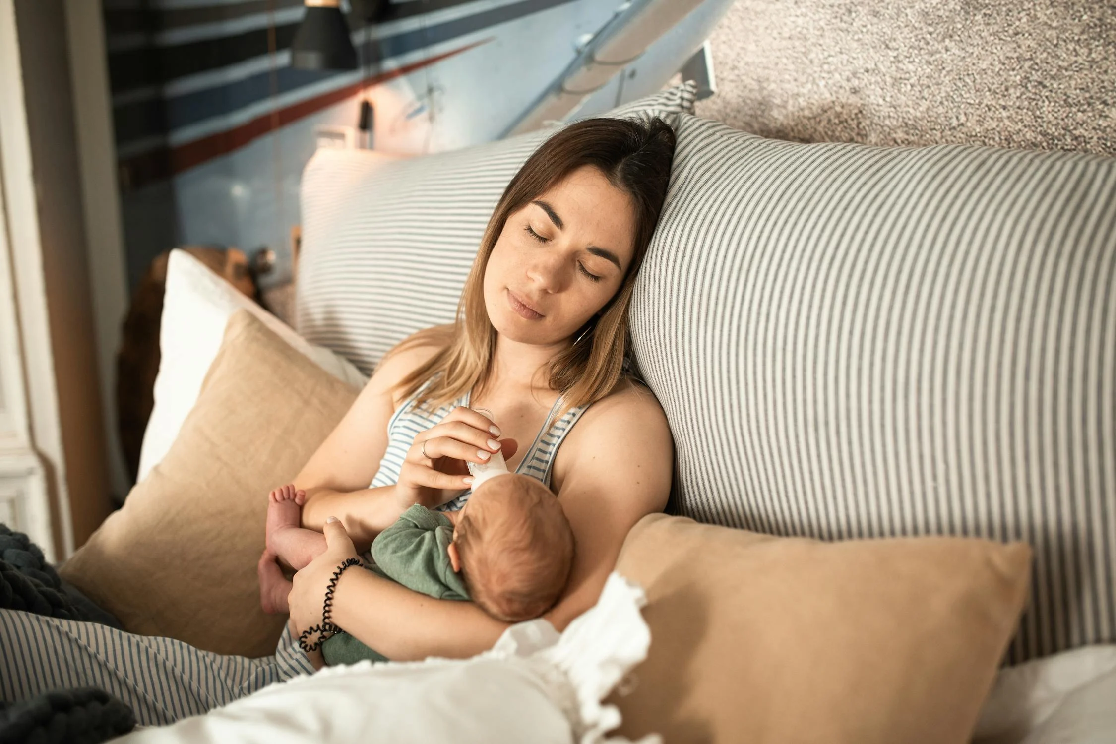 A woman feeding her baby | Source: Pexels