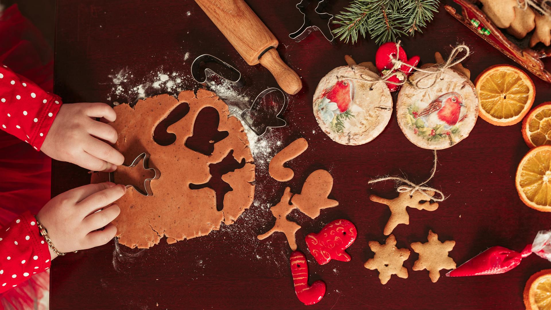 A child cutting shapes from cookie dough | Source: Pexels