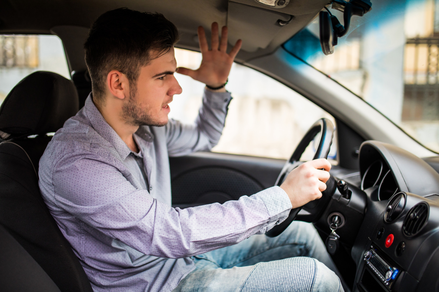 An upset man driving | Source: Freepik